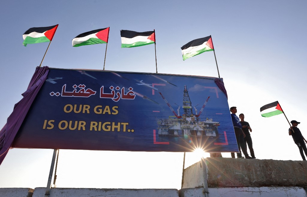 Palestinians join in a rally at the Gaza City sea port on 14 September 2022 to demand their right to receive gas from maritime fields in the eastern Mediterranean (AFP)