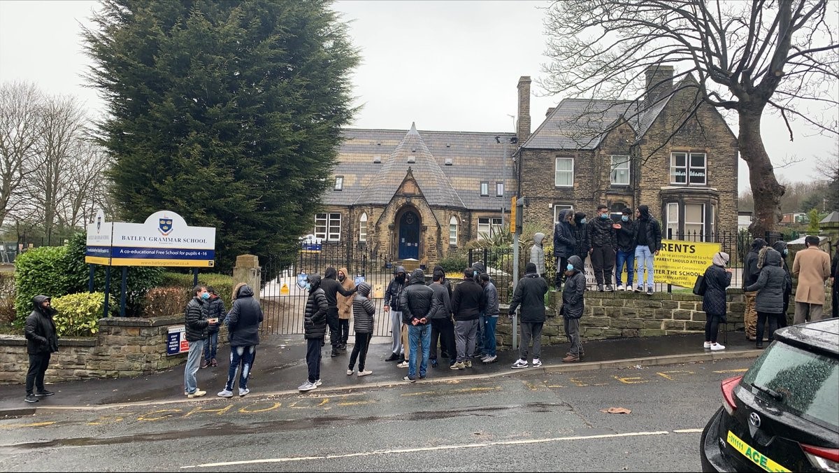 People protest outside of Batley Grammer School on 26 March (Twitter)