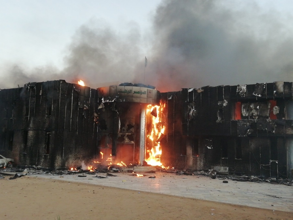 Images circulated on social media showing the Sudanese ruling party's offices on fire in Atbara (Twitter)
