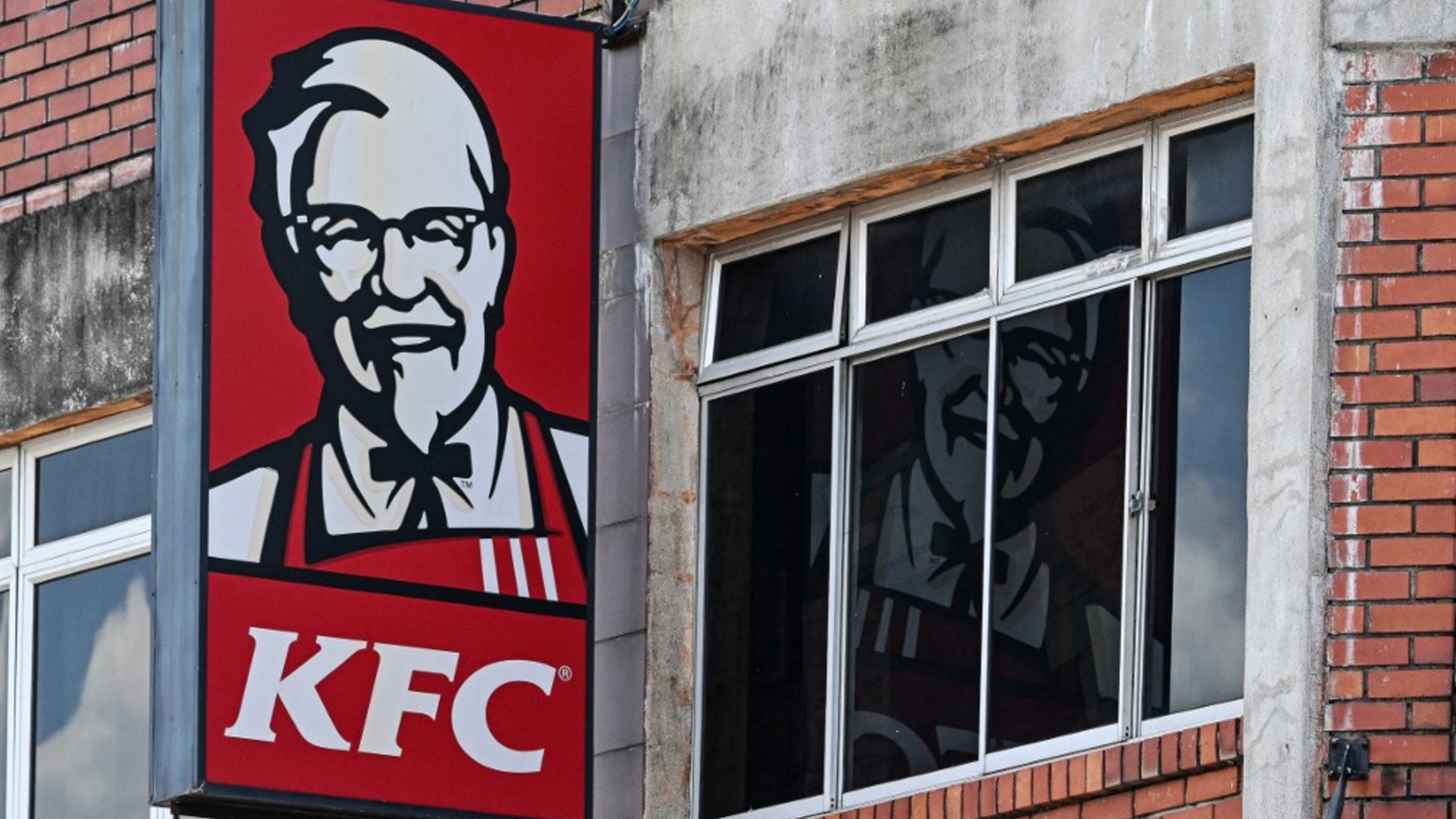 The logo of Kentucky Fried Chicken (KFC) is pictured at a restaurant in Malaysia's Pahang state, 30 April 2024 (AFP)