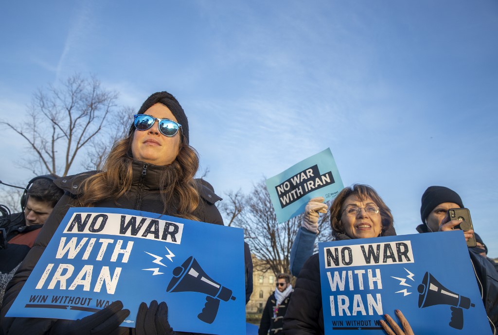Protesters warn against war with Iran in Washington on 9 January (AFP)