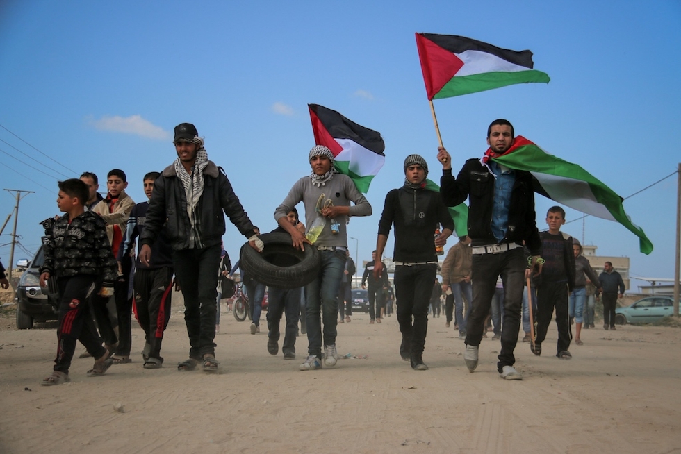 Palestinian activists are pictured near the Gaza fence in 2018 (MEE/Mohammed al-Hajjar)