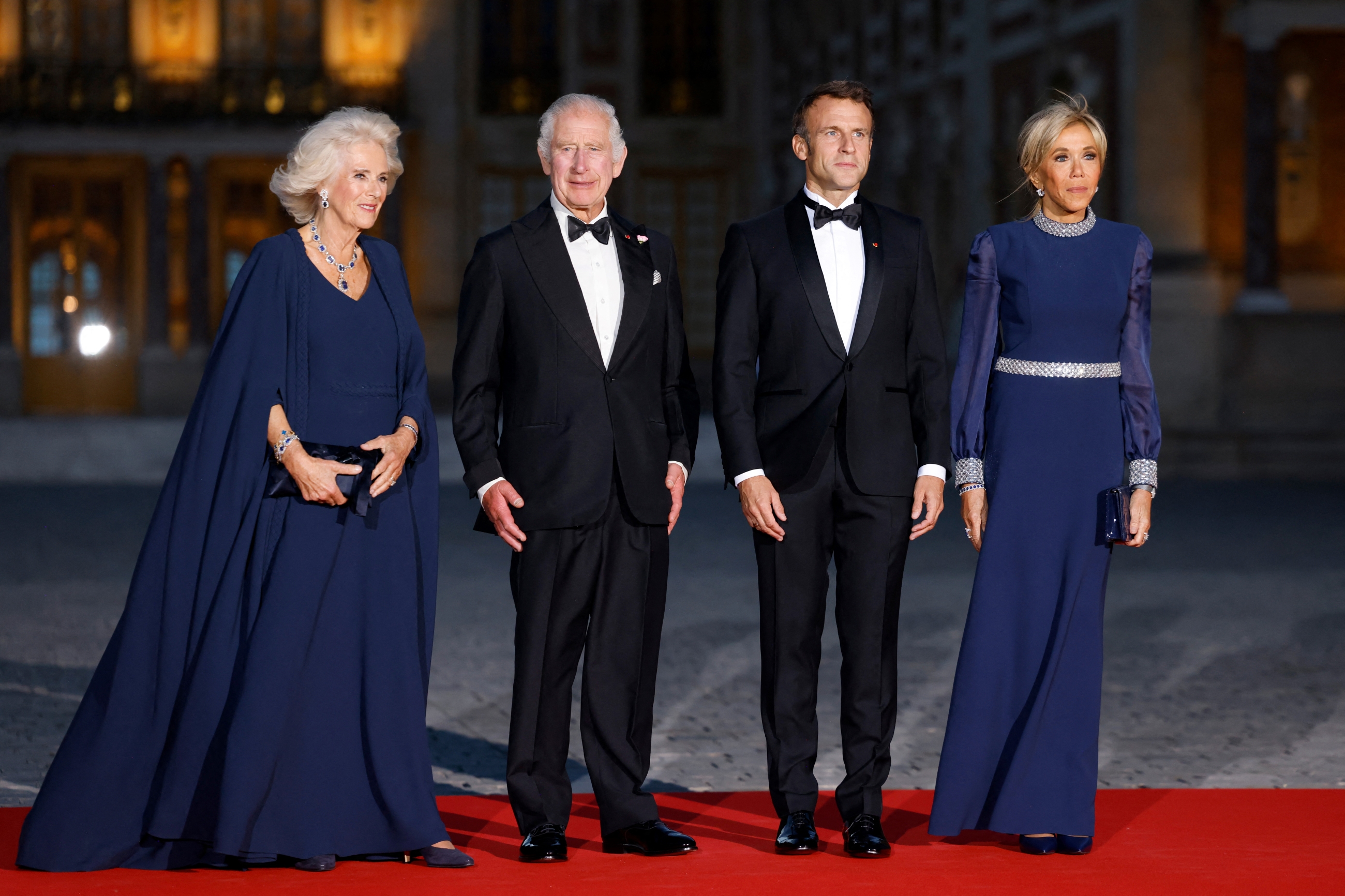 Britain's Queen Camilla and King Charles III with French President Emmanuel Macron and his wife Brigitte at a state banquet at the Palace of Versailles on Wednesday