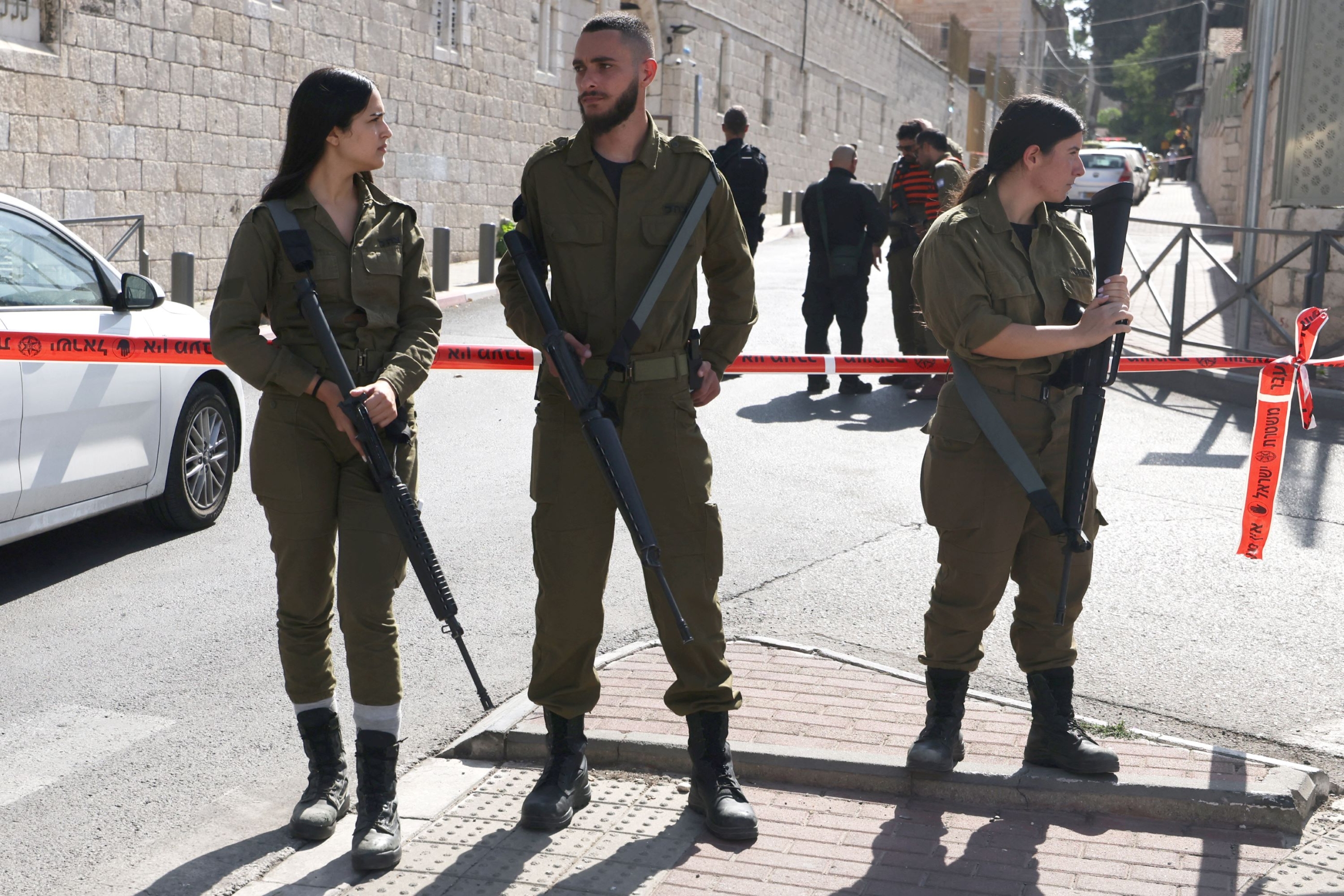 Israeli security forces deploy at the site of a reported attack in east Jerusalem on 30 October 2023 (AFP)