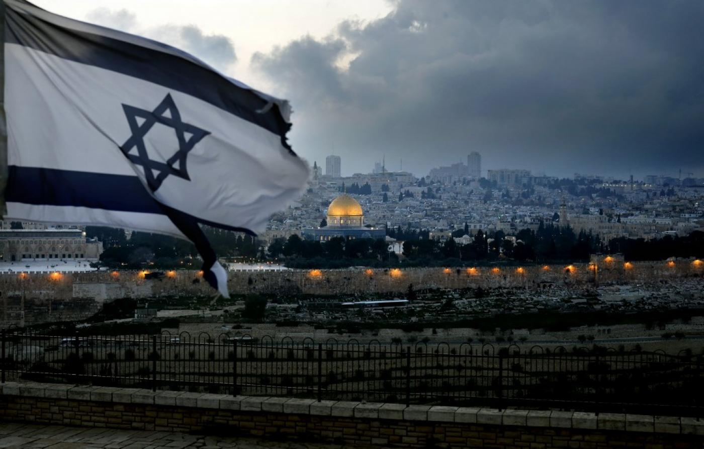 Israeli flag with Old City of Jerusalem in background