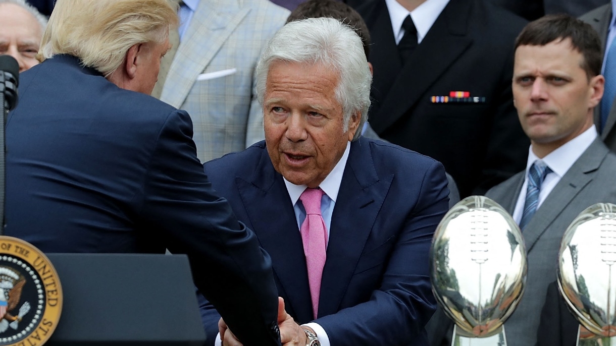 New England Patriots owner Robert Kraft (C) is congratulated by US President Donald Trump during an event celebrating the team's Super Bowl win at the White House on 19 April 2017.