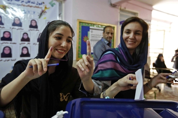 Iranian%20women%20cast%20their%20ballots%20for%20the%20presidential%20elections%20at%20a%20polling%20station%20north%20of%20Tehran%20on%20May%2019%202017%20afp 0