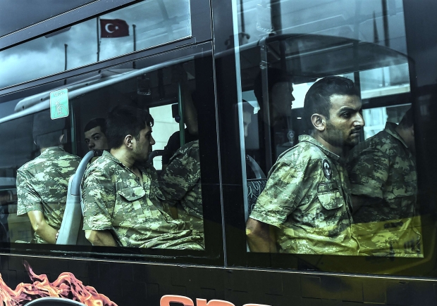 Detained Turkish soldiers who allegedly took part in the coup are escorted by bus (AFP)