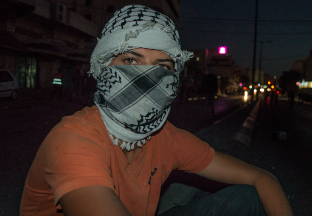A Palestinian protestor in Bethlehem (MEE / Abed al-Qaisi)