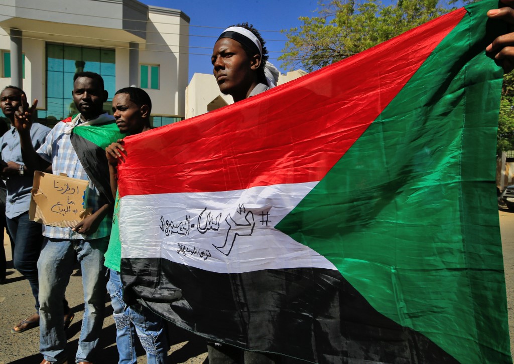 Sudanese demonstrators gather outside the Foreign Ministry in the capital Khartoum on 28 January 2020 to protest at UAE recruitment for wars in Yemen and Libya (AFP)