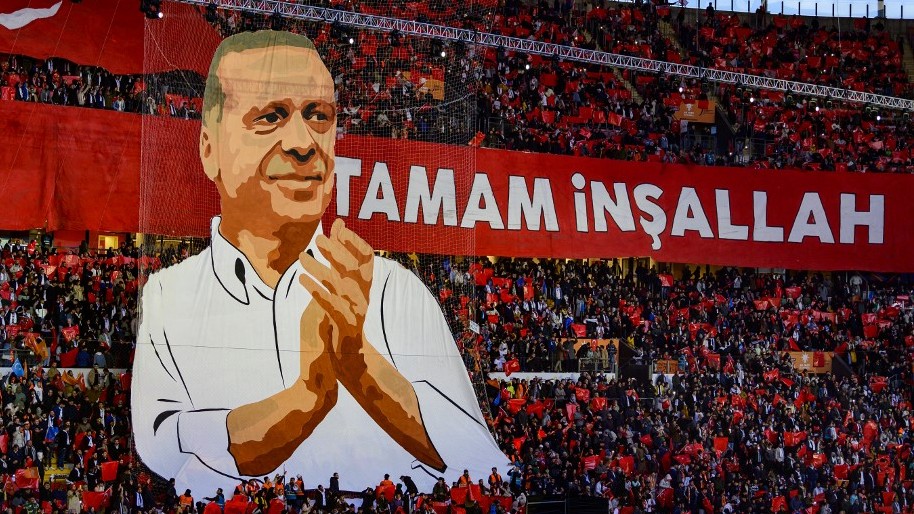 An image of Turkish President Recep Tayyip Erdogan is seen at an AK Party rally in Istanbul on 27 November 2022 (AFP)