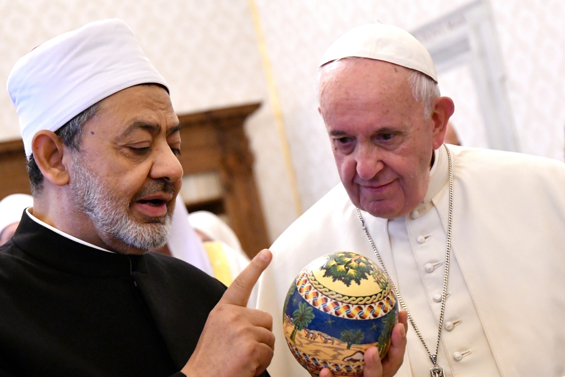 A previous bill attempted to limit the lifetime term of al-Azhar's grand imam, left, to eight years (AFP)