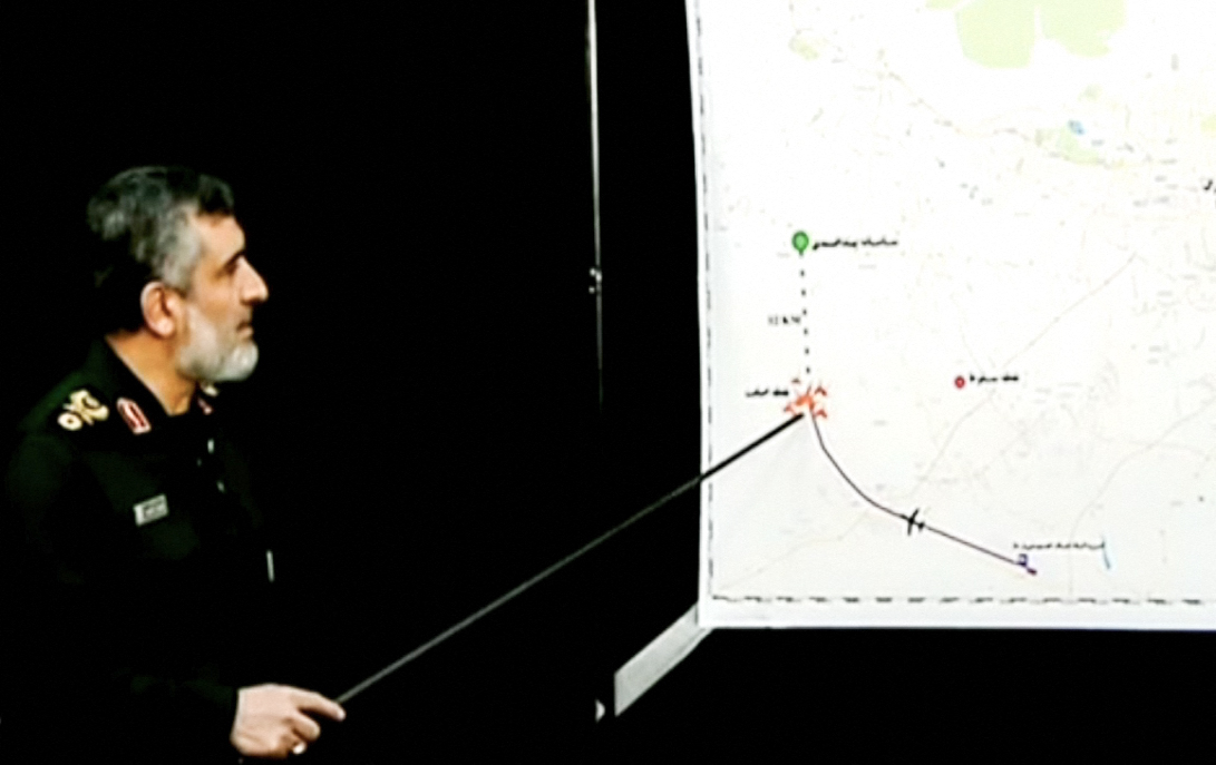 Hajizadeh pointing at a map during a televised press conference in the Tehran following the downing of a Ukrainian jet, on 11 January 2020 (AFP)