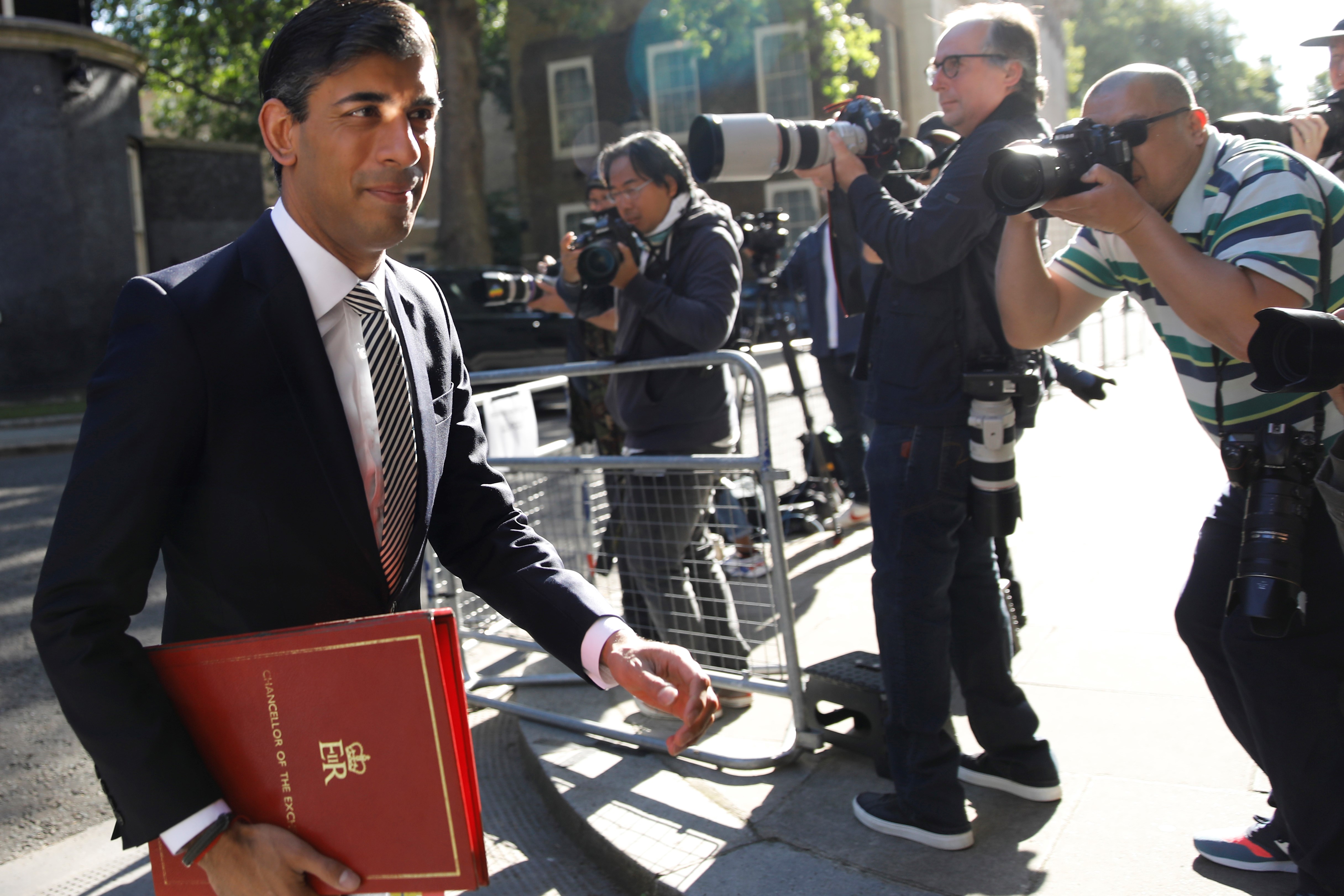 Britain's Chancellor of the Exchequer Rishi Sunak leaves Downing Street in central London to participate in the first in person cabinet meeting since the coronavirus lockdown at the Foreign and Commonwealth office on July 21, 2020.