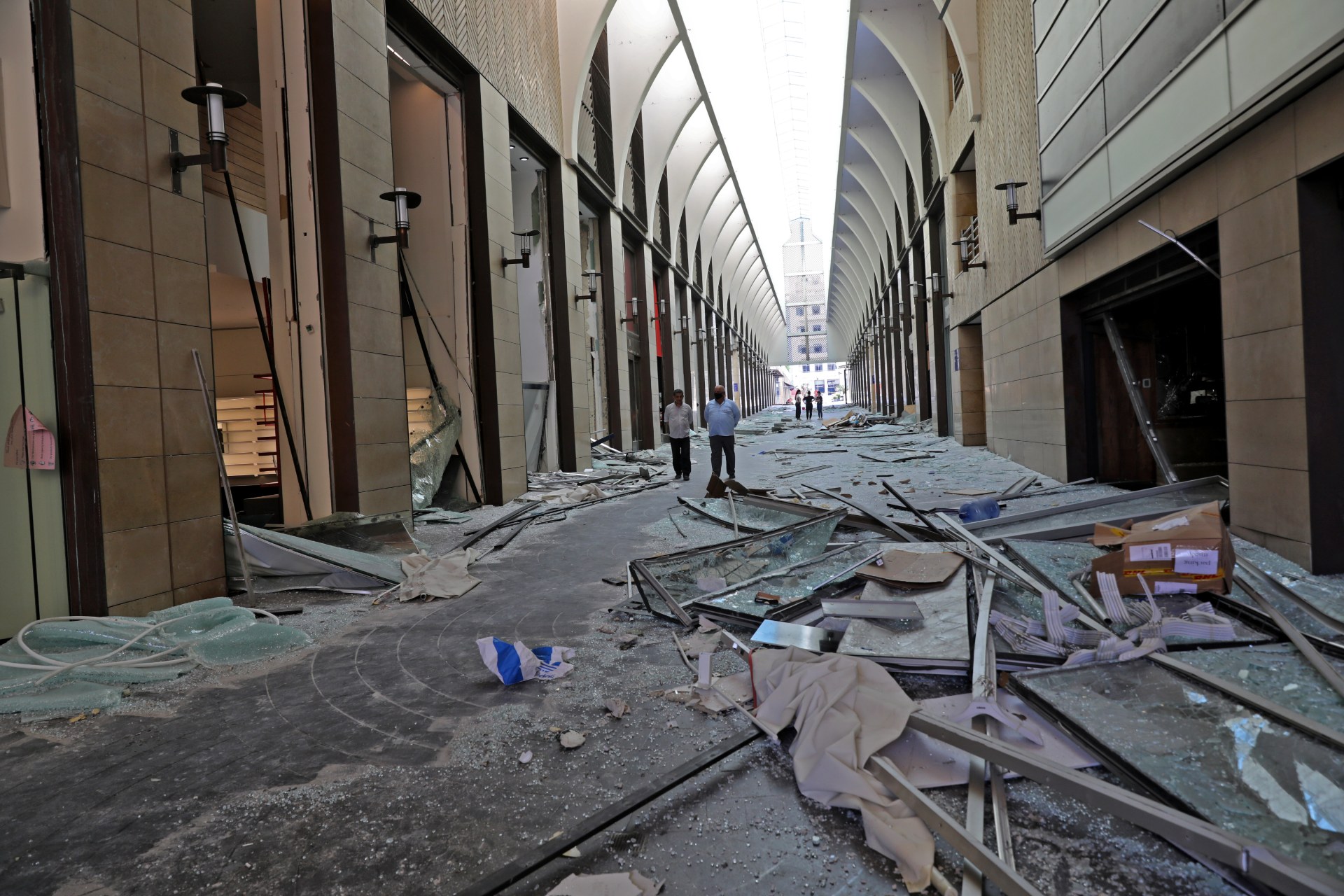 Lebanese in Beirut Souks shopping mall inspect the damage in the aftermath of yesterday's blast (AFP)
