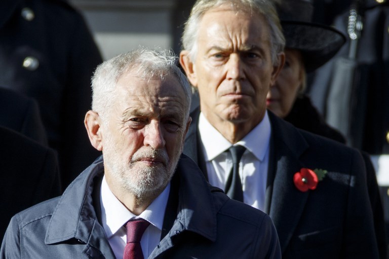 Corbyn and former British Prime Minister Tony Blair are pictured in London on 11 November (AFP)