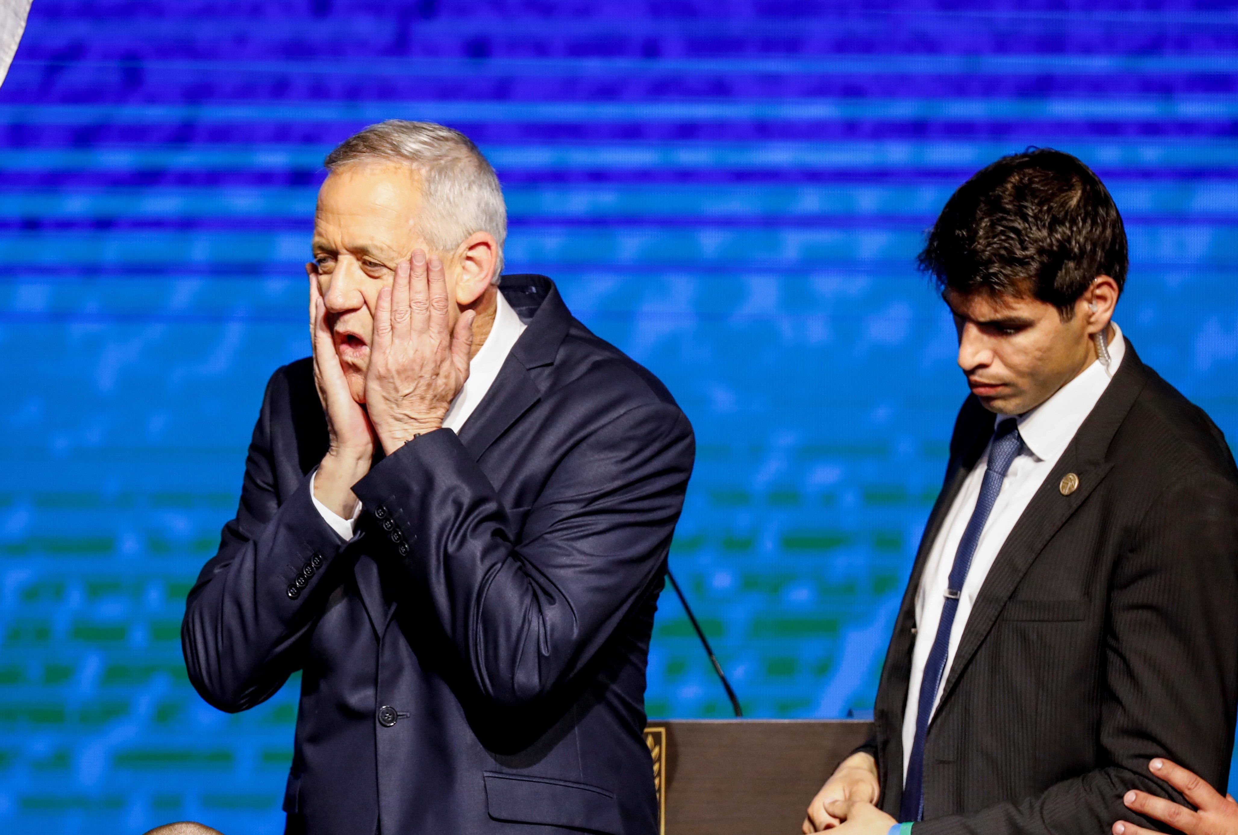 Retired Israeli general Benny Gantz (C), one of the leaders of the Blue and White on 10 April (AFP)