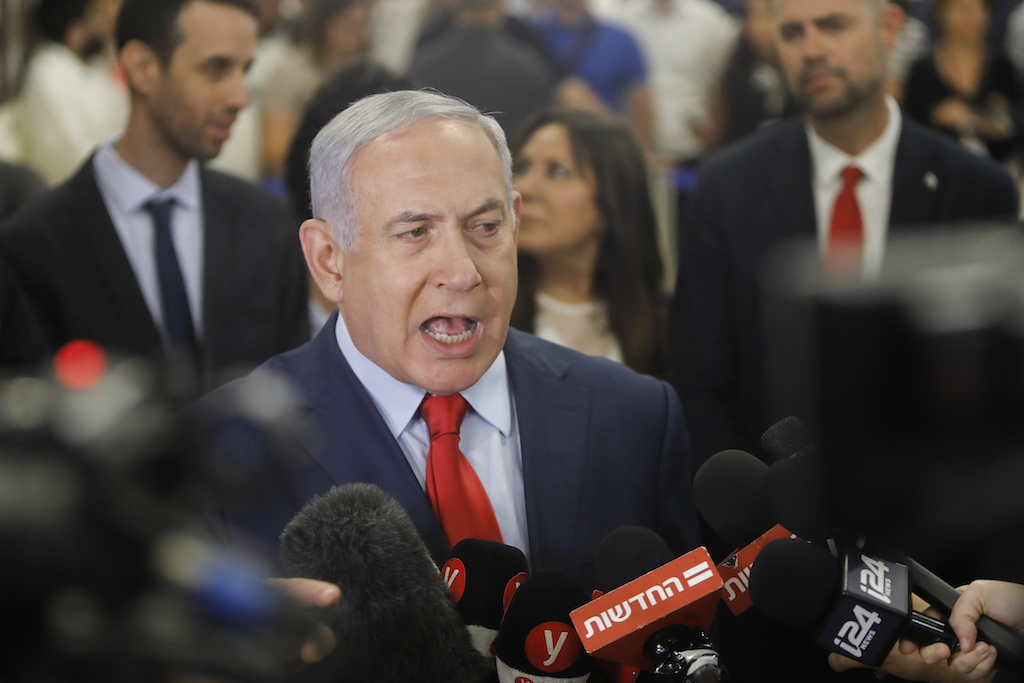 Israeli Prime Minister Benjamin Netanyahu talks to the press following a vote on a bill to dissolve the Knesset (Israeli parliament) on 29 May, 2019, at the Knesset in Jerusalem (AFP)