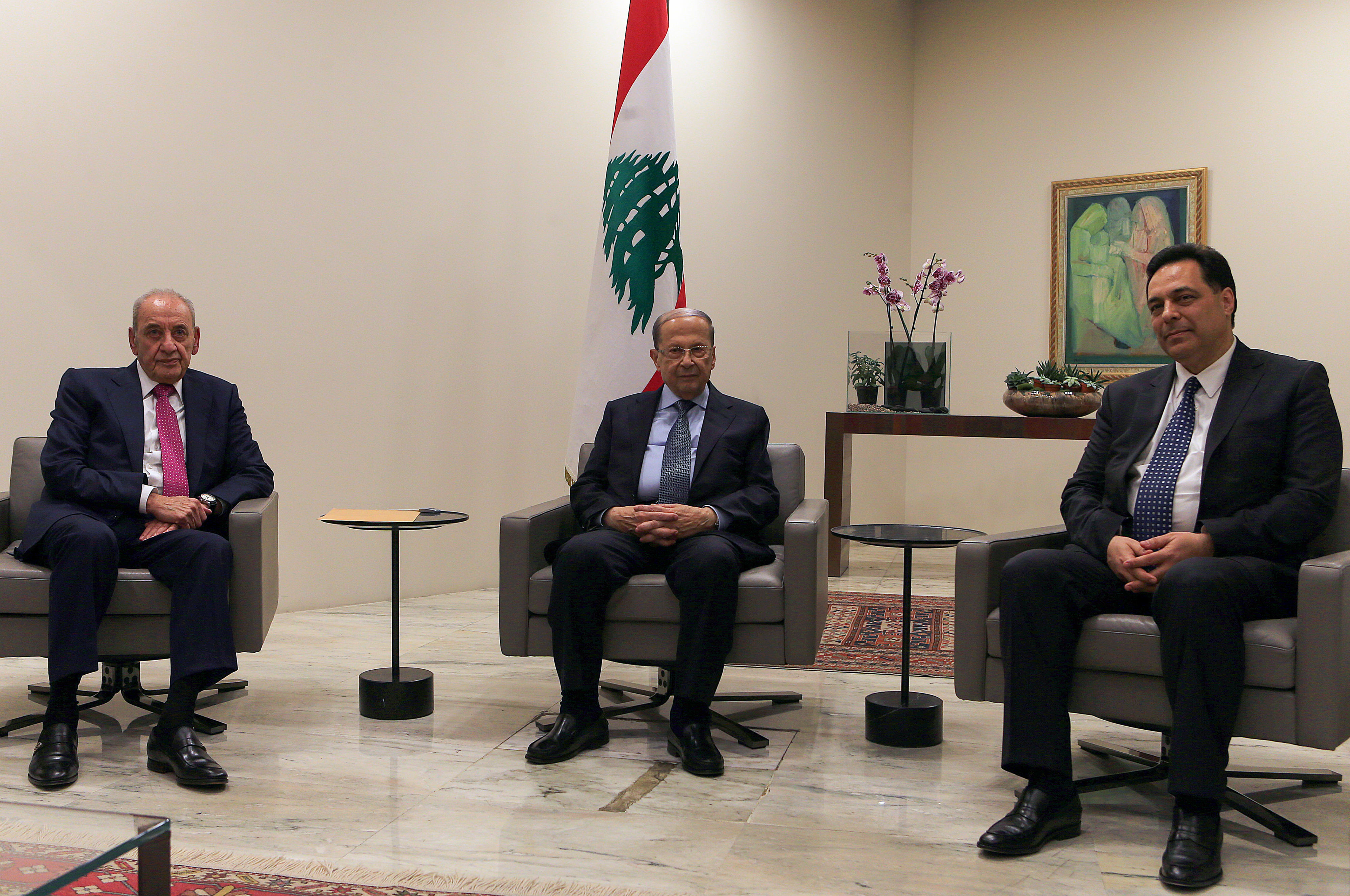 Lebanese President Michel Aoun (C) meets with Prime Minister-designate Hassan Diab (R) and Parliament Speaker Nabih Berri at the presidential palace in Baabda (AFP)