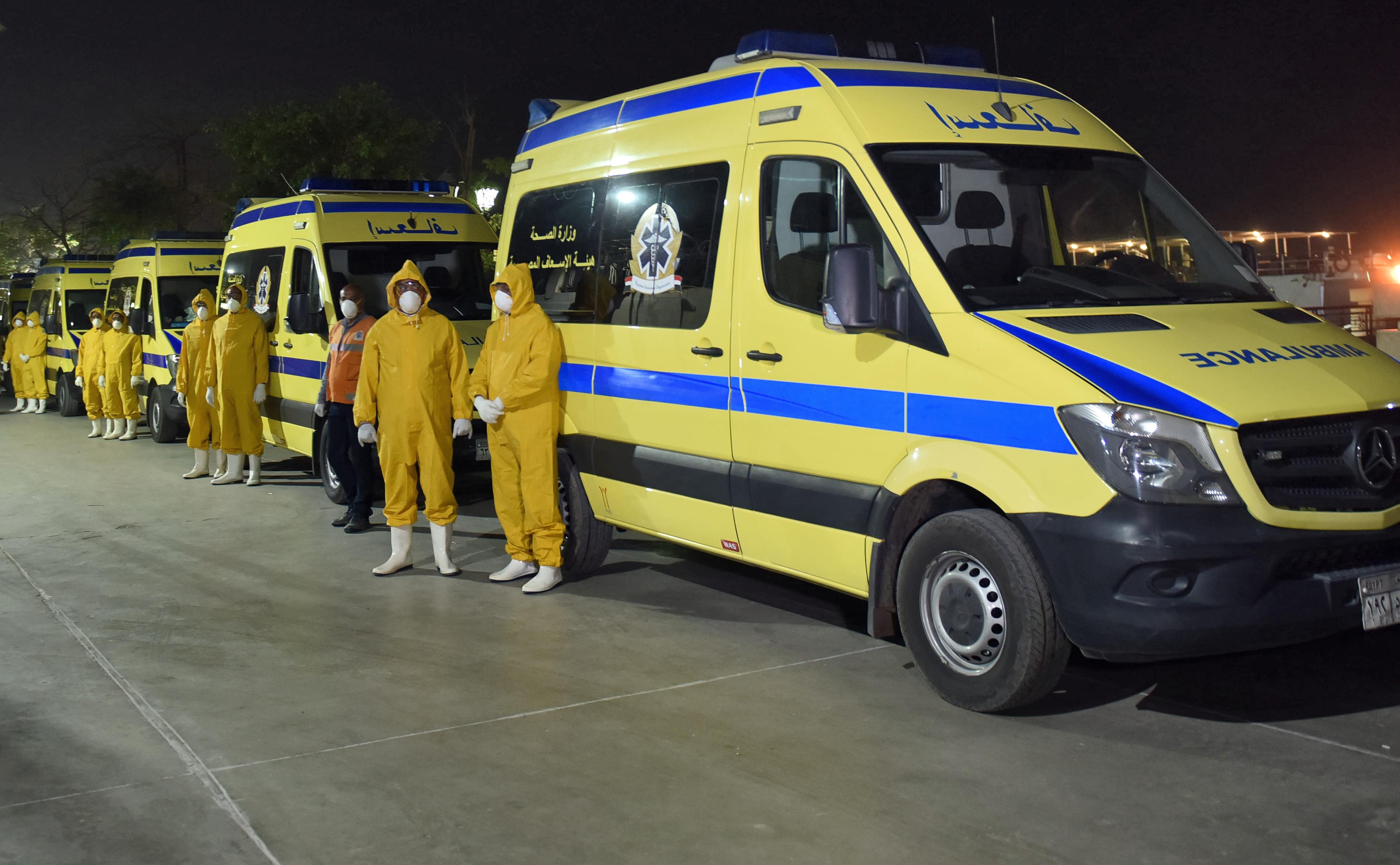  Emergency responders transport suspected COVID-19 coronavirus disease cases that were detected on a Nile cruise ship in Luxor late on 7 March 