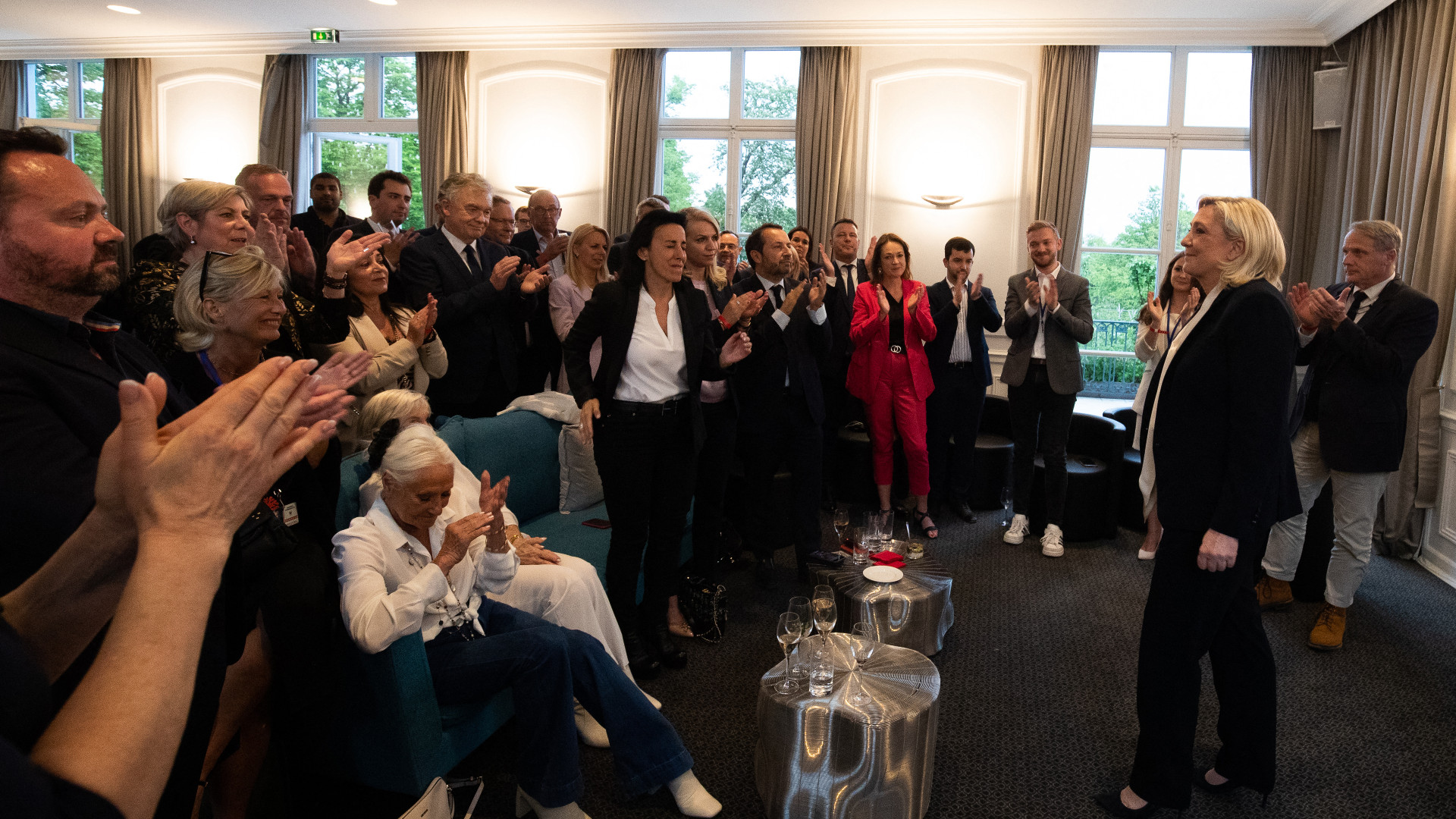 French far-right party Rassemblement National presidential candidate Marine Le Pen speaks with supporters in Paris, on 24 April, 2022, following the announcement of the election results. (AFP)