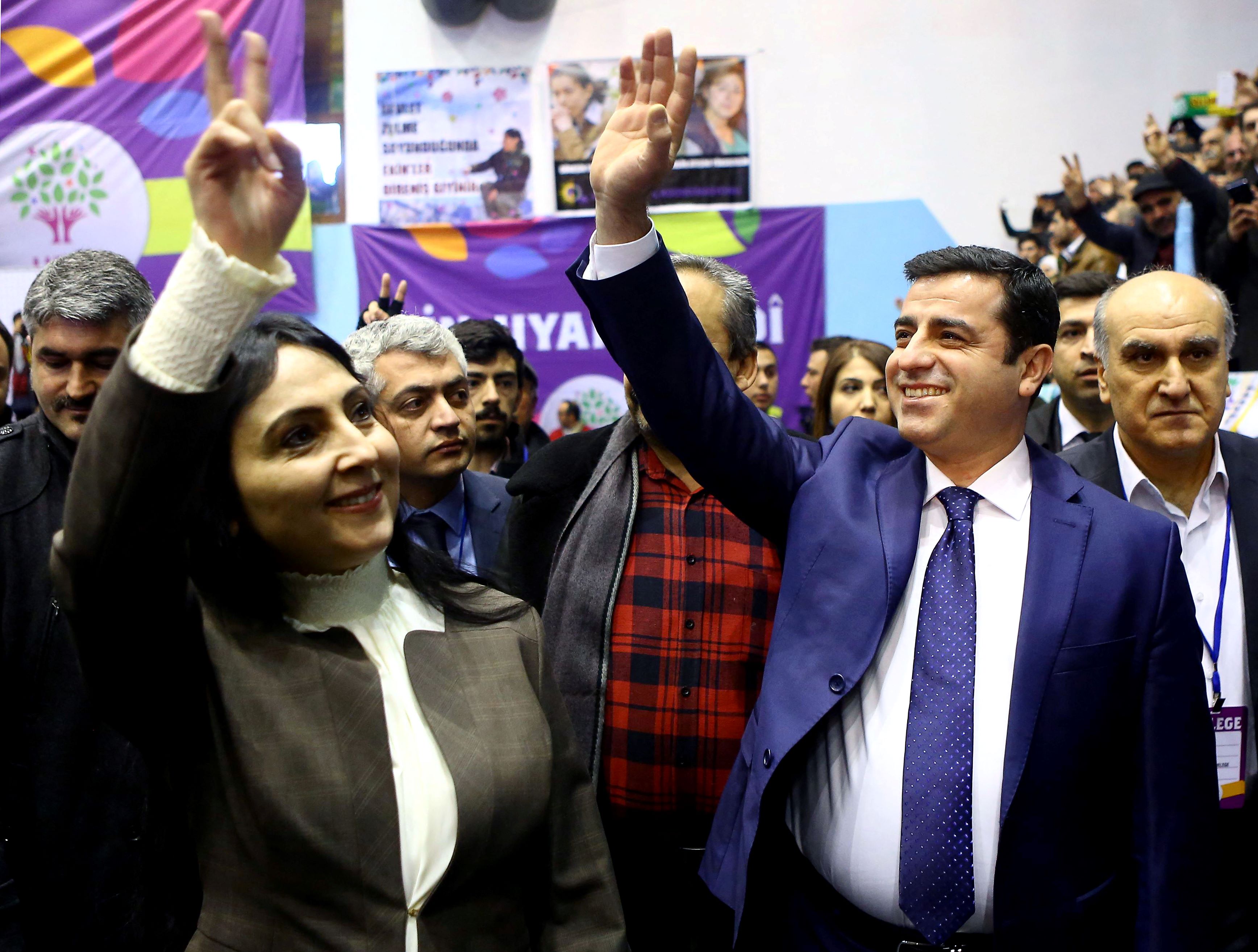 Co-leaders of the pro-Kurdish Peoples' Democratic Party (HDP) Selahattin Demirtas (R) and Figen Yuksekdag (L) wave as they attend the second general assembly in 2015 (AFP)