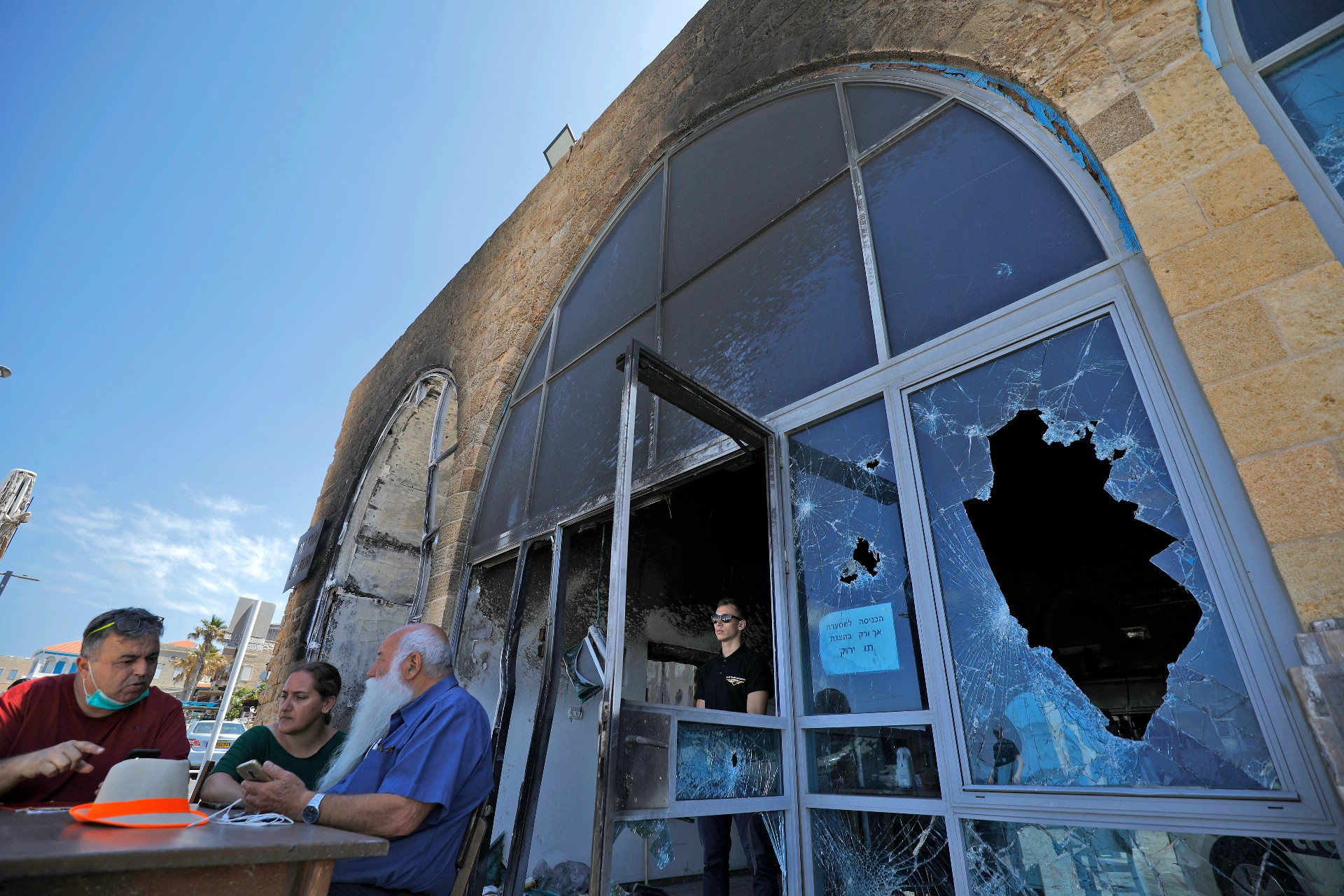 A restaurant in Acre after it was attacked and damaged in May 2021 (AFP)