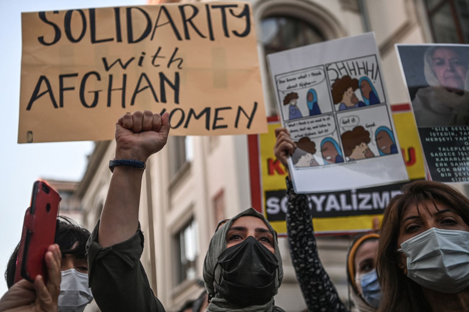 Women hold placards and shout slogans against the Taliban on August 20, 2021 in Istanbul, during a protest in solidarity to Afghan women in Afghanistan after the Taliban takeover (AFP)