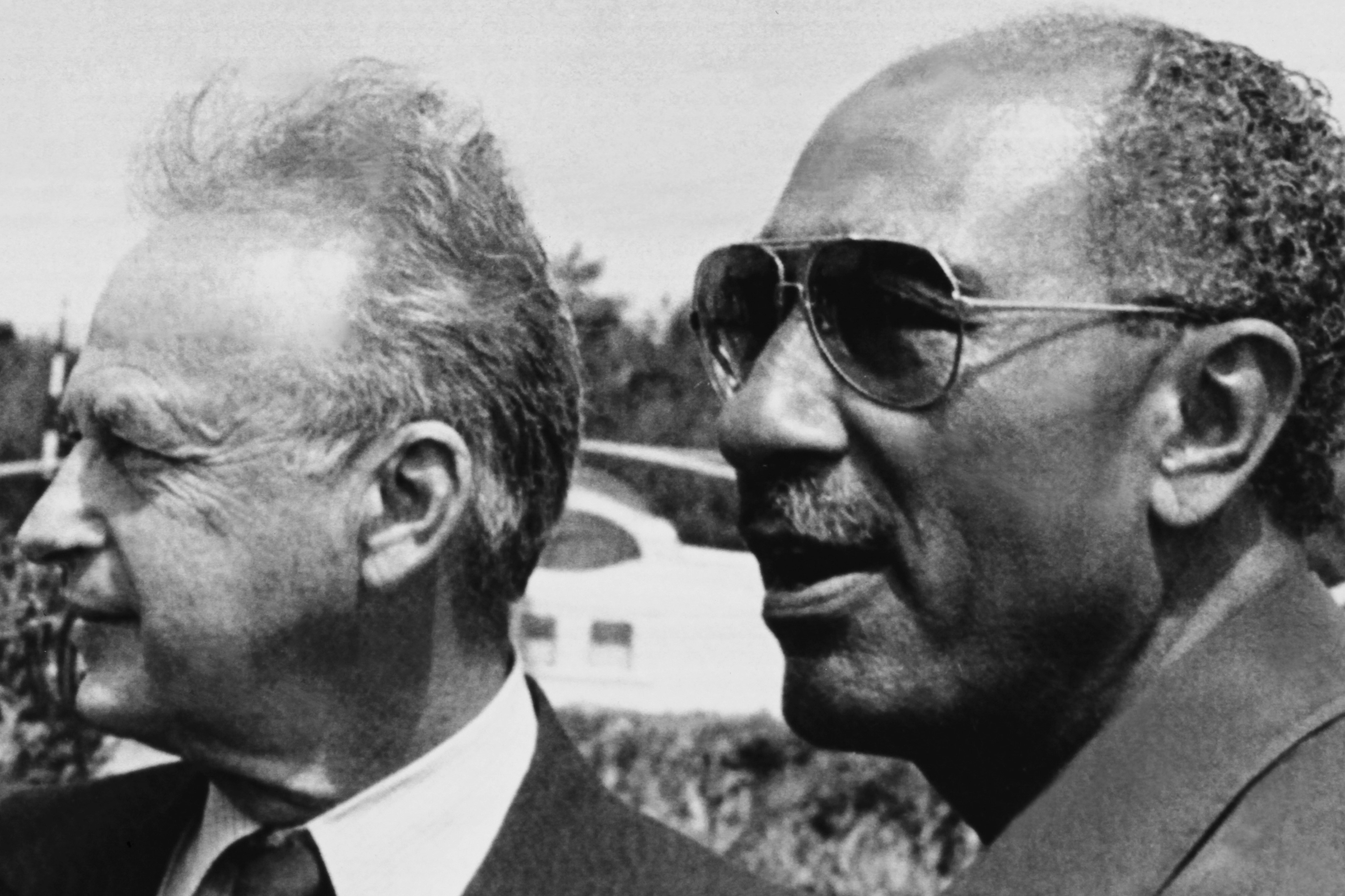 photo taken on September 9, 1980 in Alexandria shows Israeli Prime Minister Yitzhak Rabin (L) and President of Egypt Anouar el Sadate (R). 