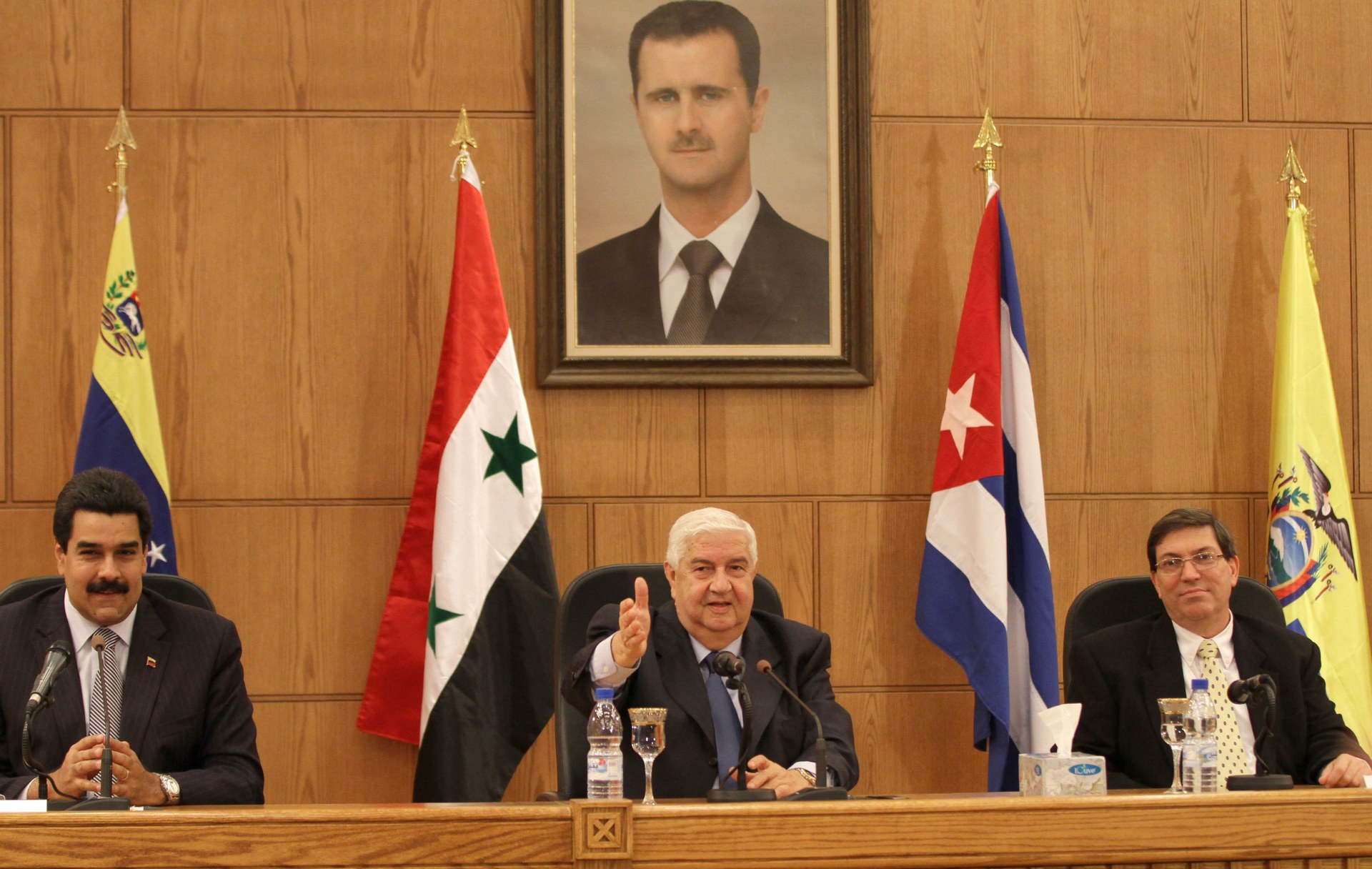 Nicolas Maduro, Syrian Foreign Minister Walid Muallem and Cuban Foreign Minister Bruno Eduardo Rodríguez Parrilla in Damascus in 2011 (AFP)