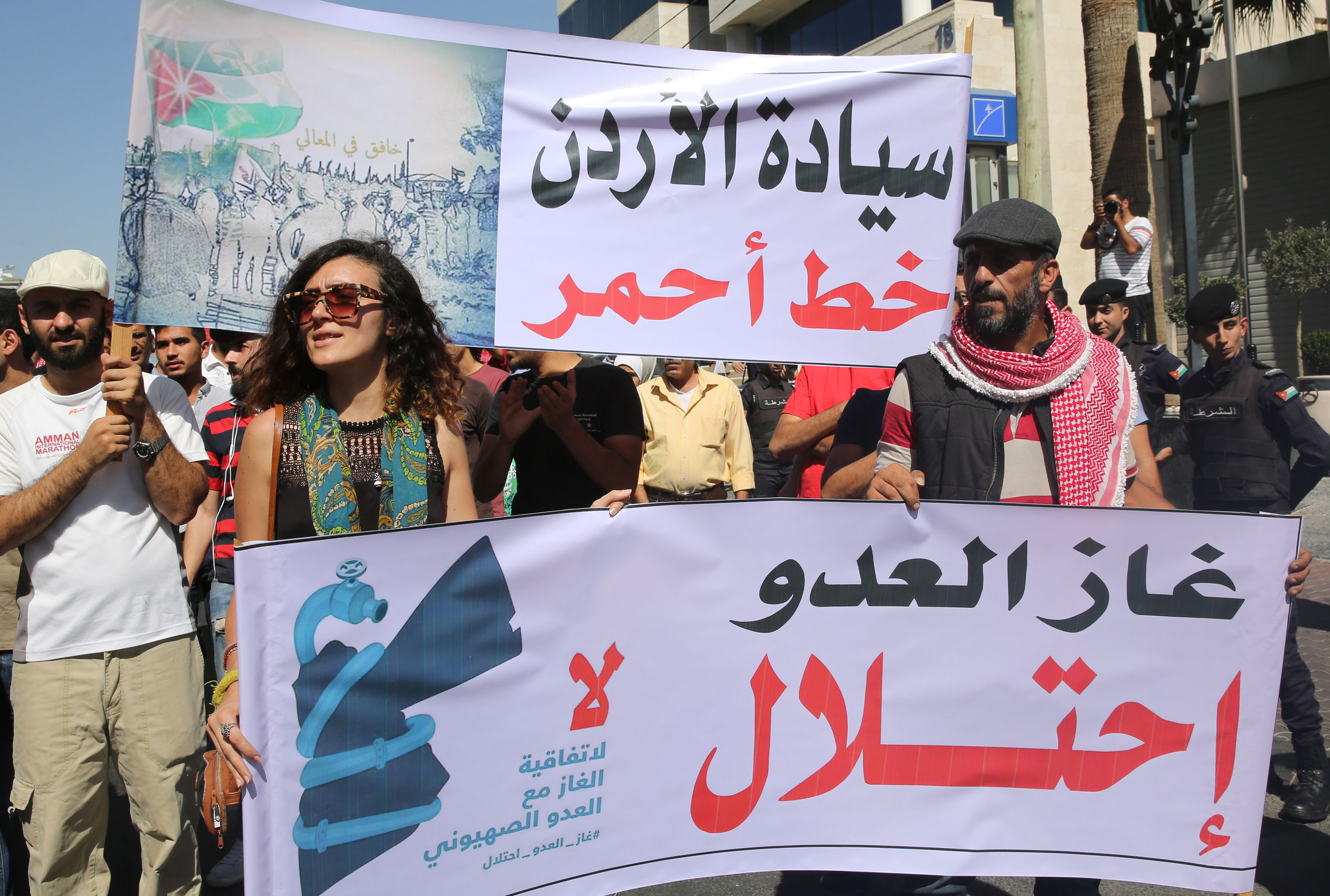 Jordanian protesters hold slogans reading, " no to normalisation with the zionist enemy", "gas, enemy, occupation" during a protest in Amman in 2016 (AFP)