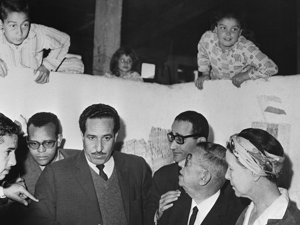Sartre (second from right) and Simone de Beauvoir (right) visit a Palestinian refugee camp in Gaza in 1967 (AFP)