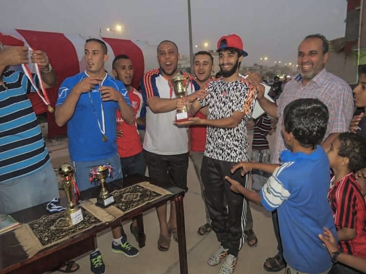 Alaa Faraj holding a football trophy in Benghazi before he left in 2015 (Supplied)