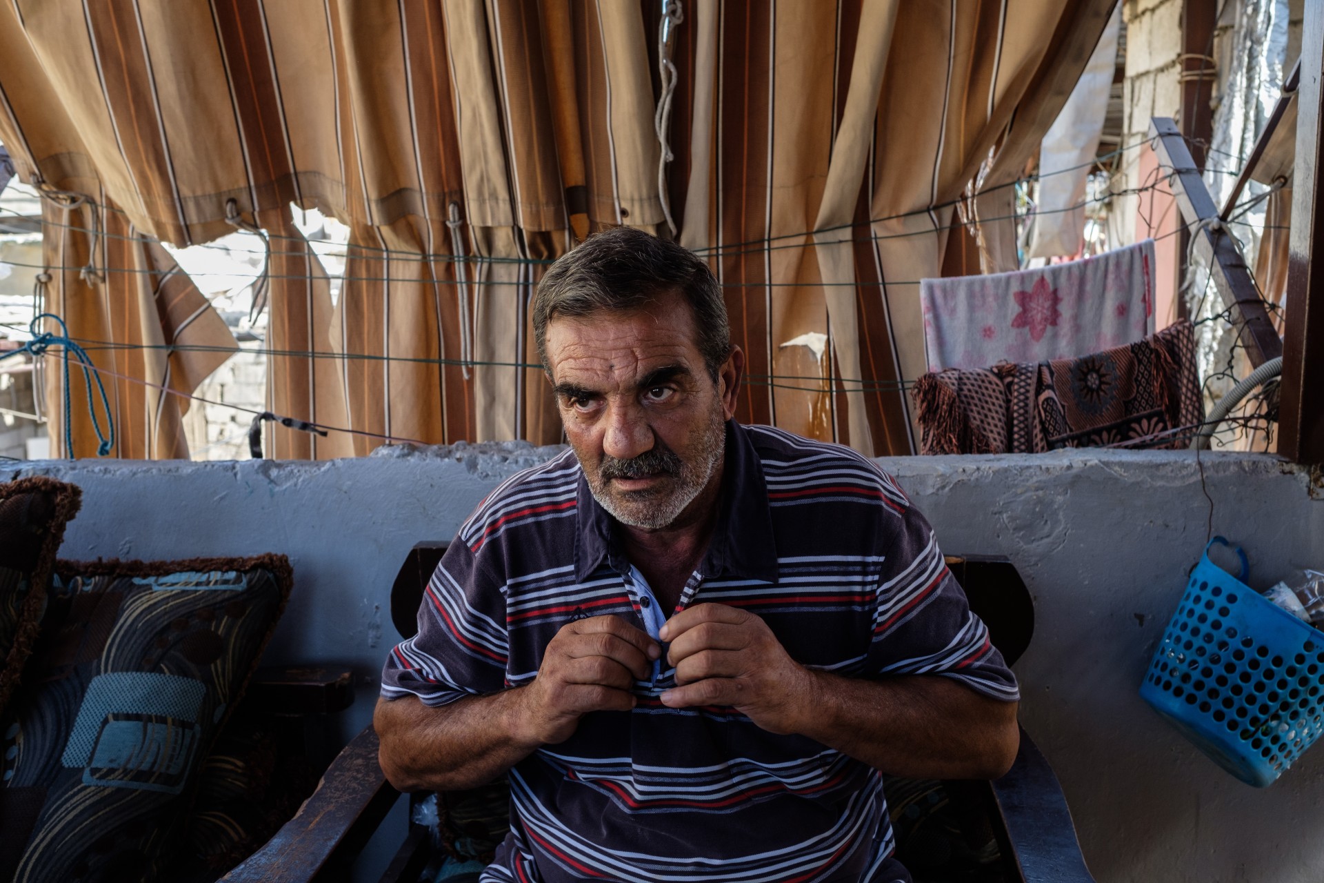 Riddah Ali Fayyad’s at his home in an area referred to as Horsh, where the massacre started (MEE/Rita Kabalan)