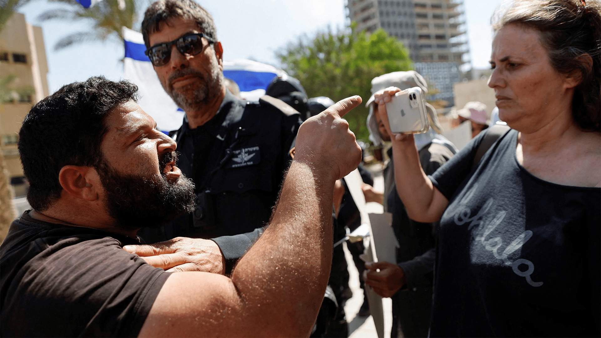 Far-right politici Almog Cohen argues with a protester supporting Palestinian Mohammad El Halabi during a demonstration outside an Israeli court in Beer Sheba, on 15 Israel, June, 2022. (Reuters)