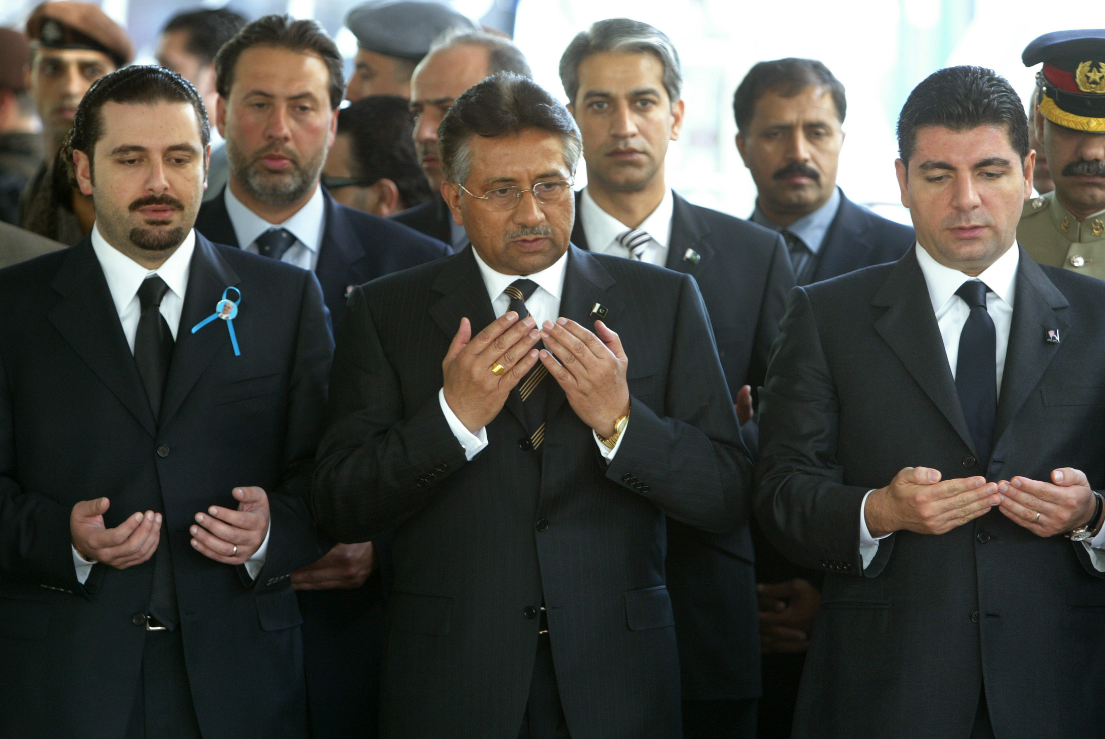 Then Pakistani President Pervez Musharraf (C) with Saad Hariri (L) and Baha al-Hariri (R), in Beirut in 2005 (Reuters)