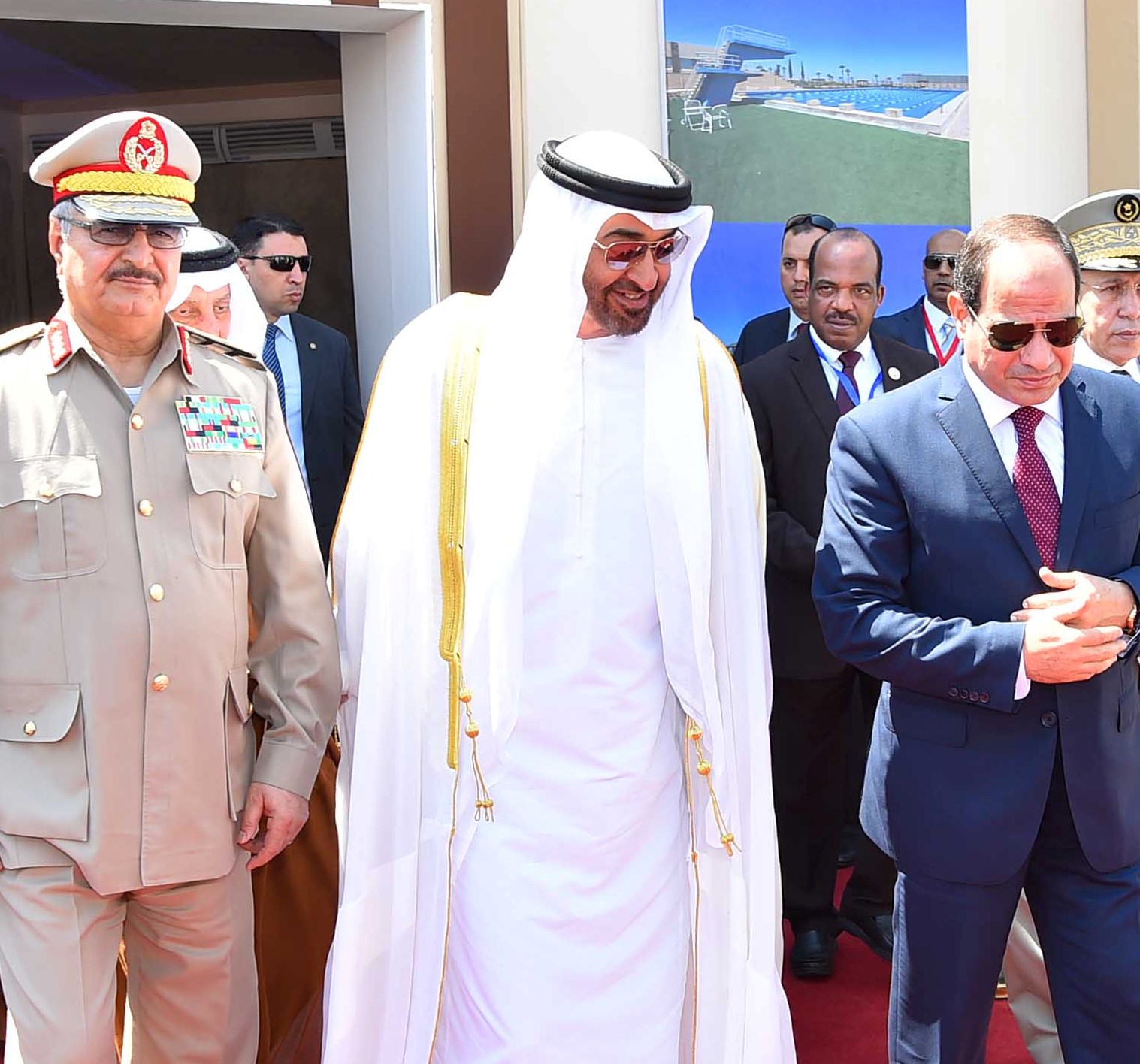 Egyptian President Abdel Fattah al-Sisi (R) arrives with Arab leaders Sheikh Mohammed bin Zayed (C), Crown Prince of Abu Dhabi, and General Khalifa Haftar
