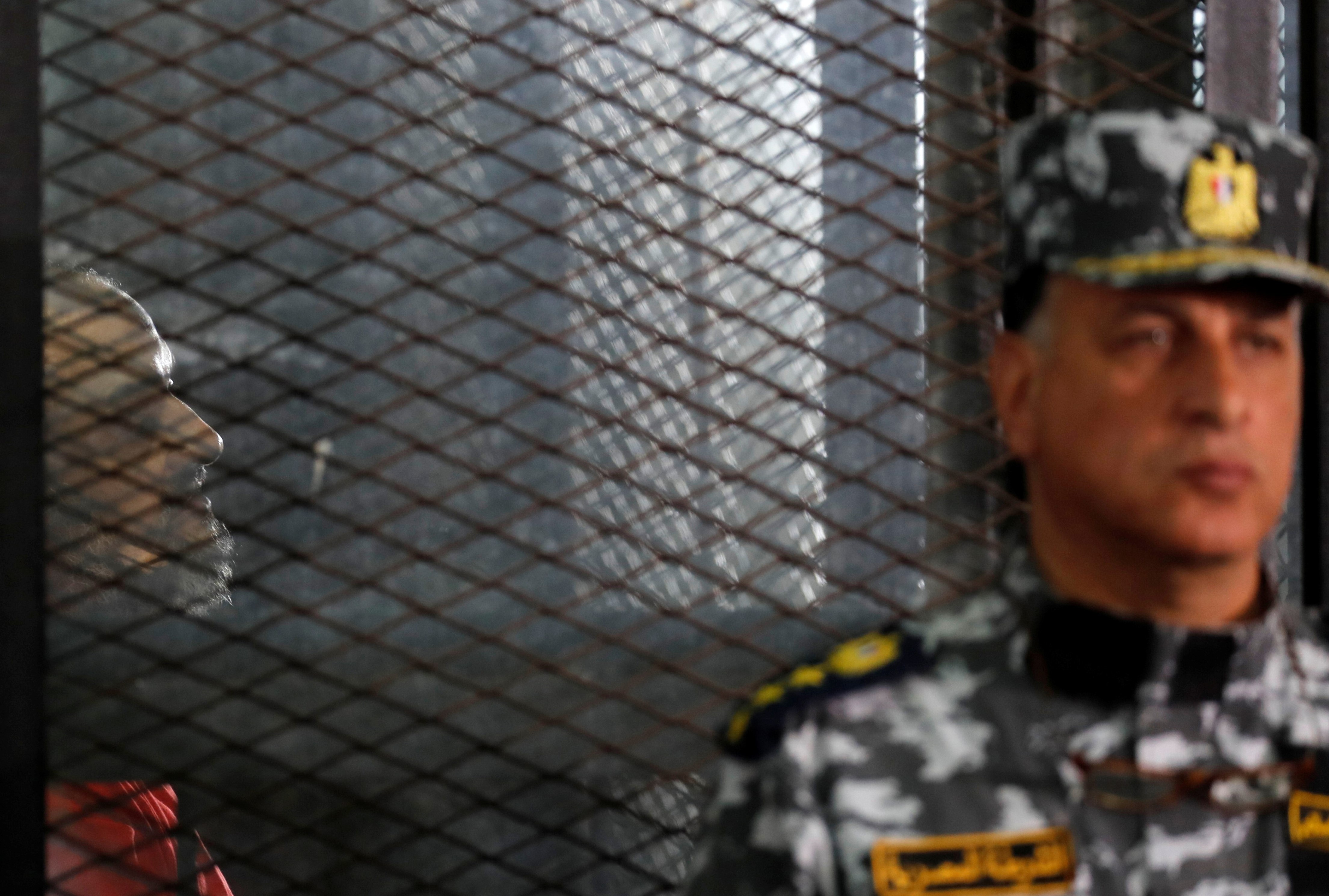 Muslim Brotherhood's senior member Mohamed El-Beltagy is seen behind bars during a court case on 26 December, 2018 (Reuters)