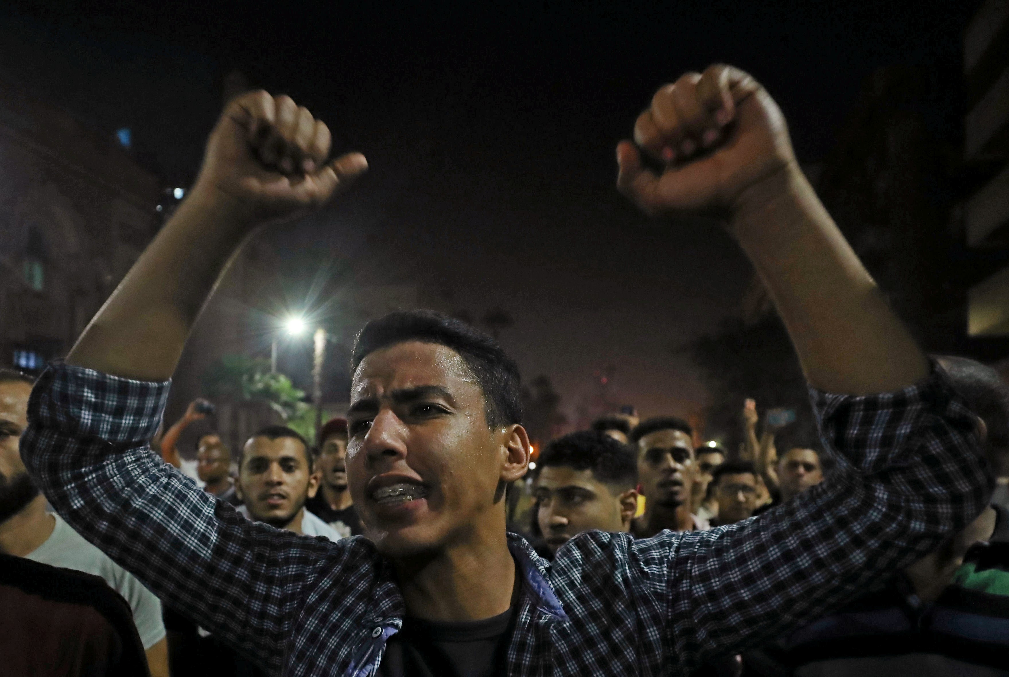 Small groups of protesters gather in central Cairo shouting anti-government slogans in Cairo on 21 September (Reuters)