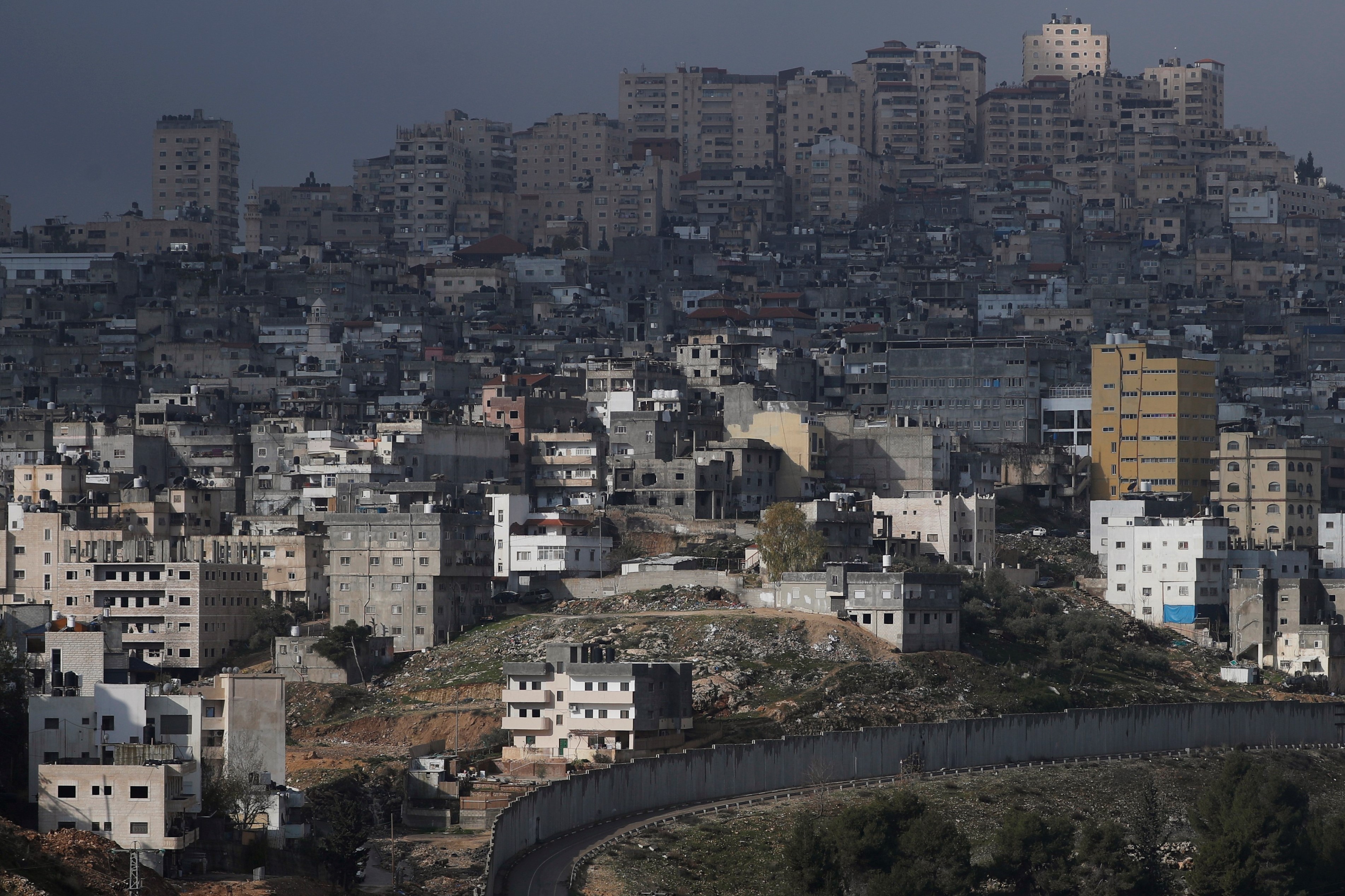 The Shuafat refugee camp in East Jerusalem is seen behind the Israeli barrier, in an area Israel annexed to Jerusalem after capturing it in the 1967 Middle East war January 29, 2020