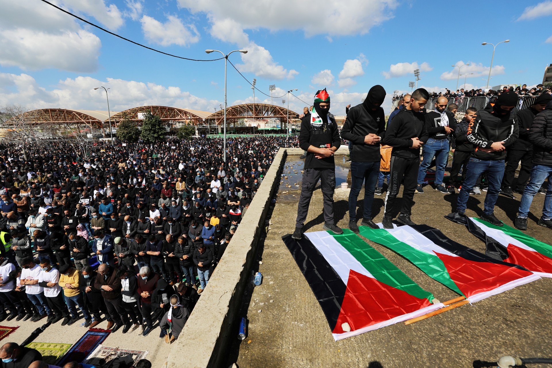 Palestinians pray as they take part in a protest against a wave of crime and violence in their communities (Reuters)