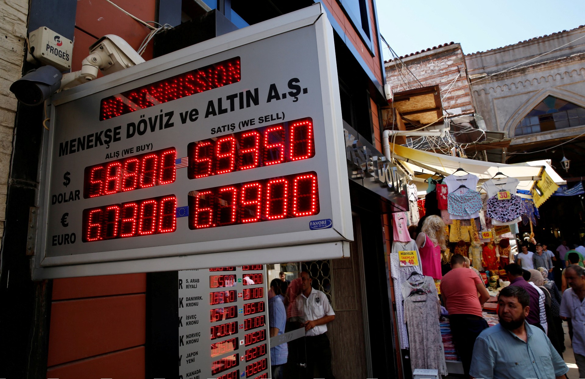 People check currency exchange rates at a currency exchange office in Istanbul (Reuters)
