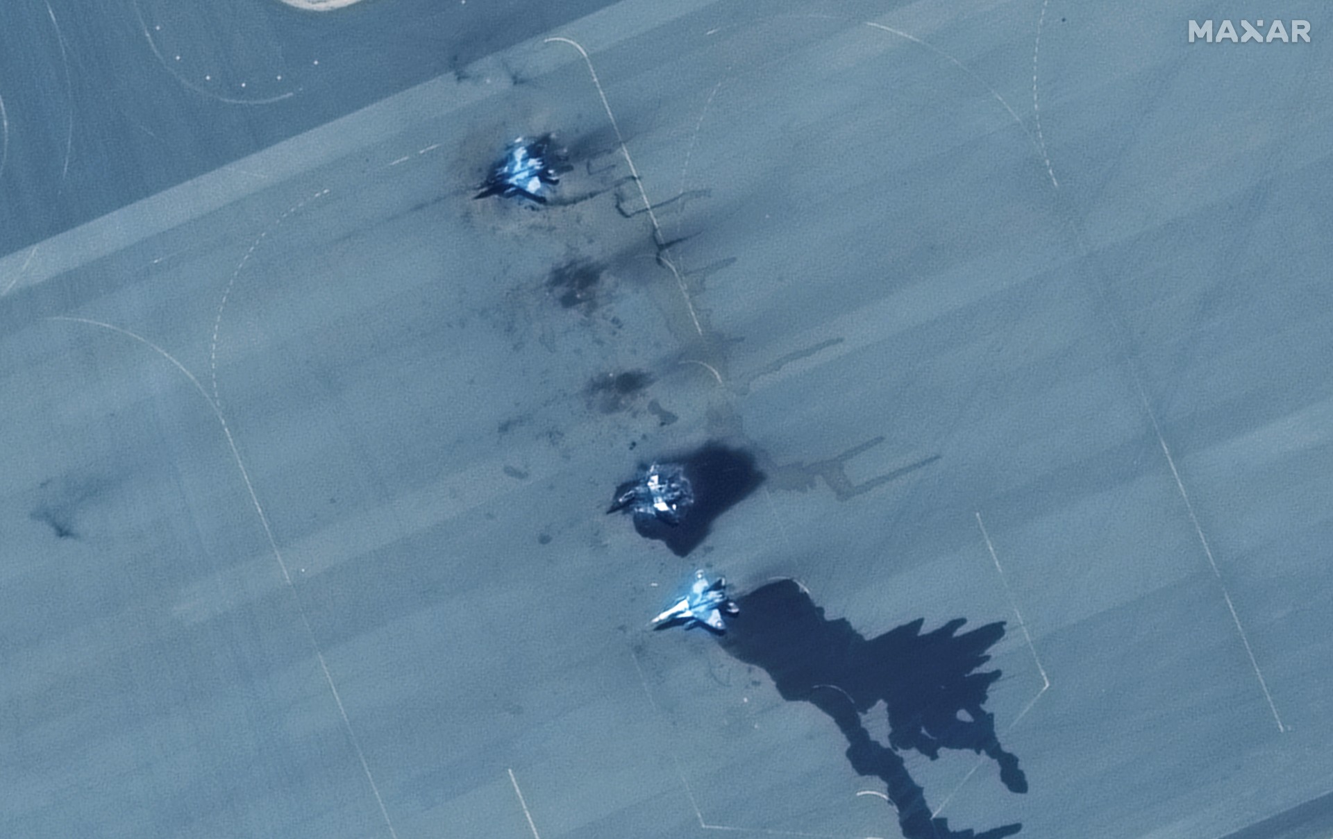 Satellite image shows a closer view of damaged MiG-29 fighter aircraft at the Merowe Airbase, Sudan, 18 April (Reuters)