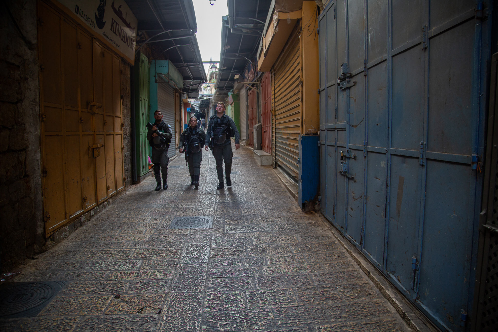 Israeli forces walk through Jerusalem's Old City which looked like a ghost town as shop owners observed the day of disobedience on 12 October 2022 (MEE/Latifeh Abdellatif)