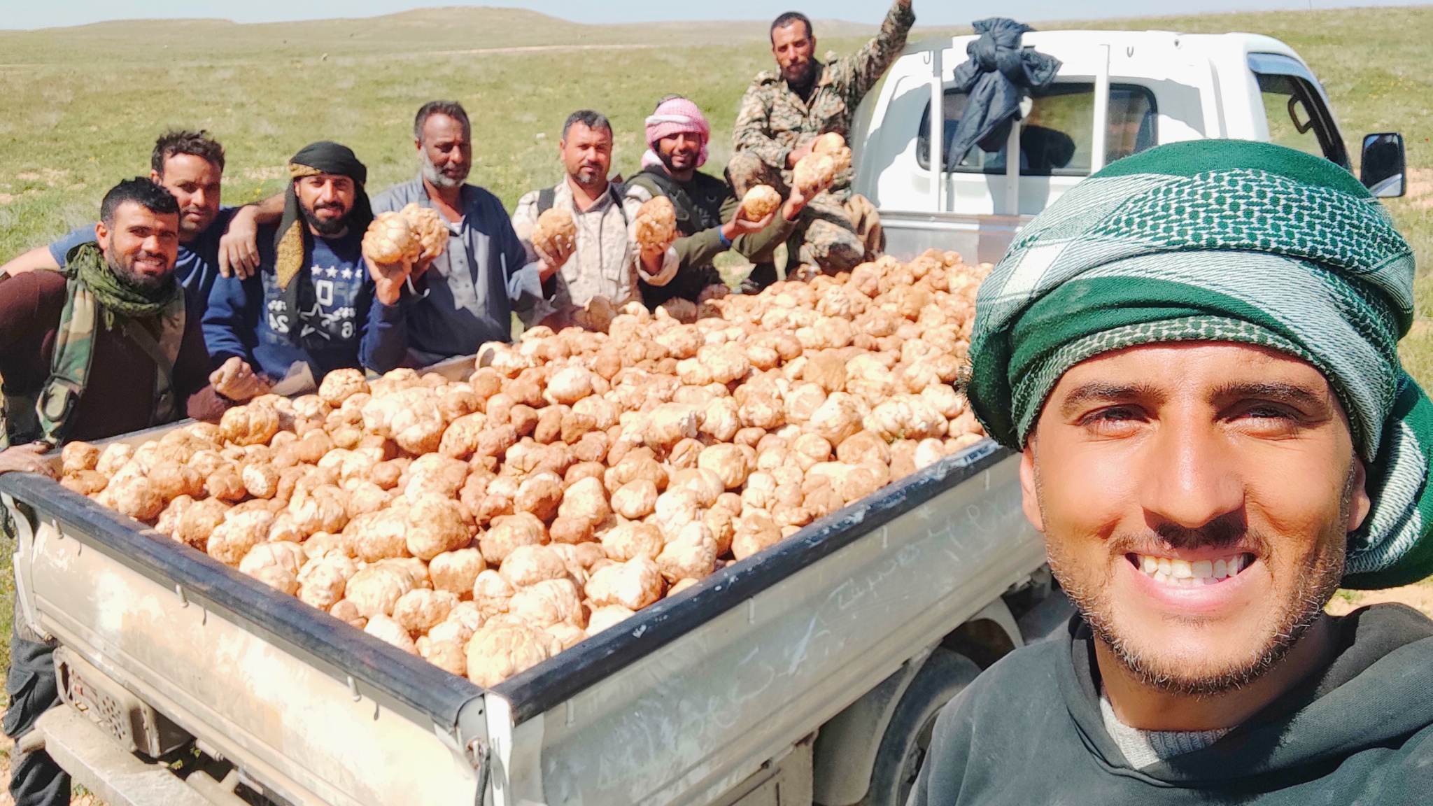 Syrian truffle hunters pose with their harvest (social media)
