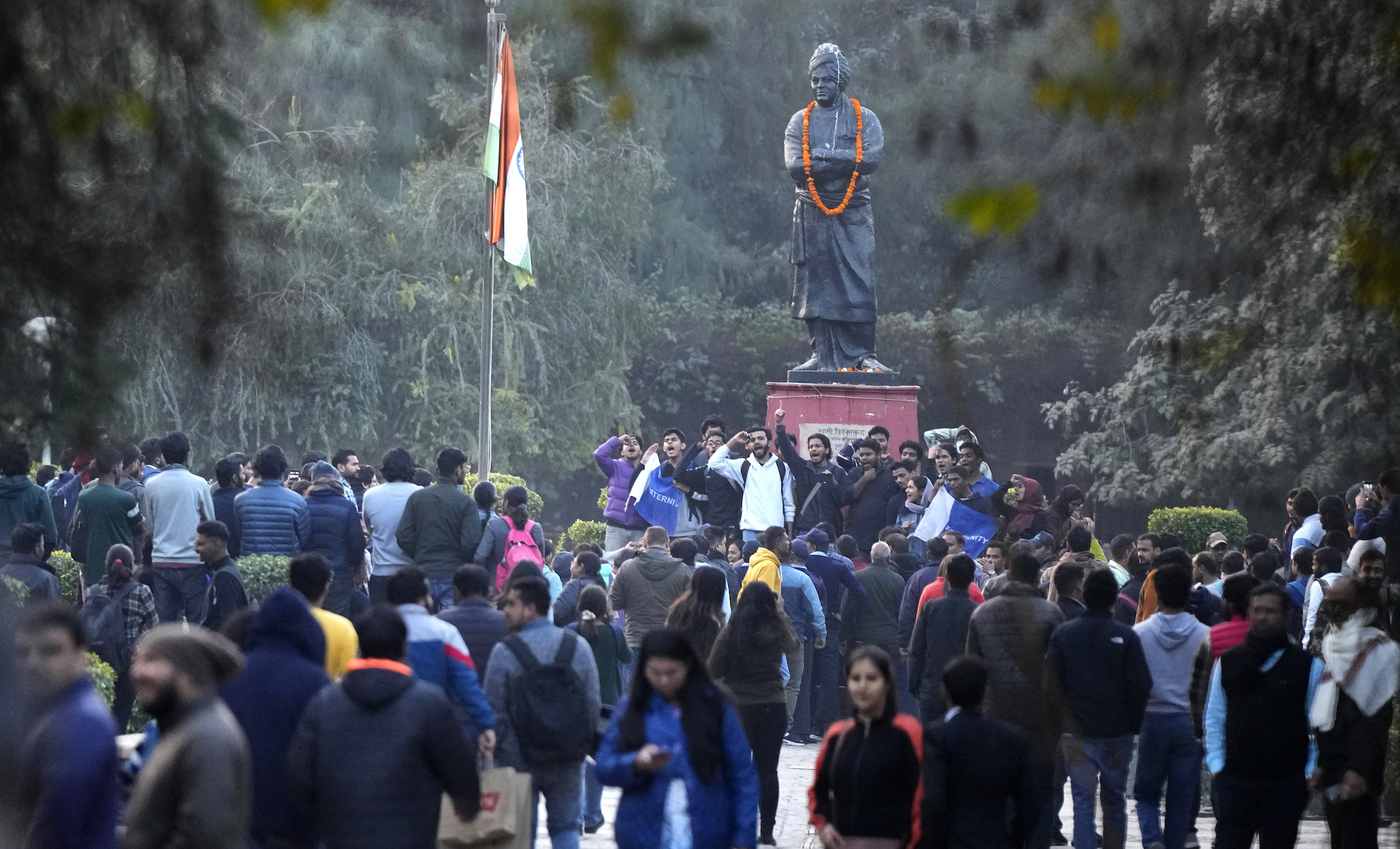 A group of students shout anti-government slogans as they are not allowed to screen a BBC documentary at Delhi University campus in New Delhi, India, Friday, Jan. 27, 2023