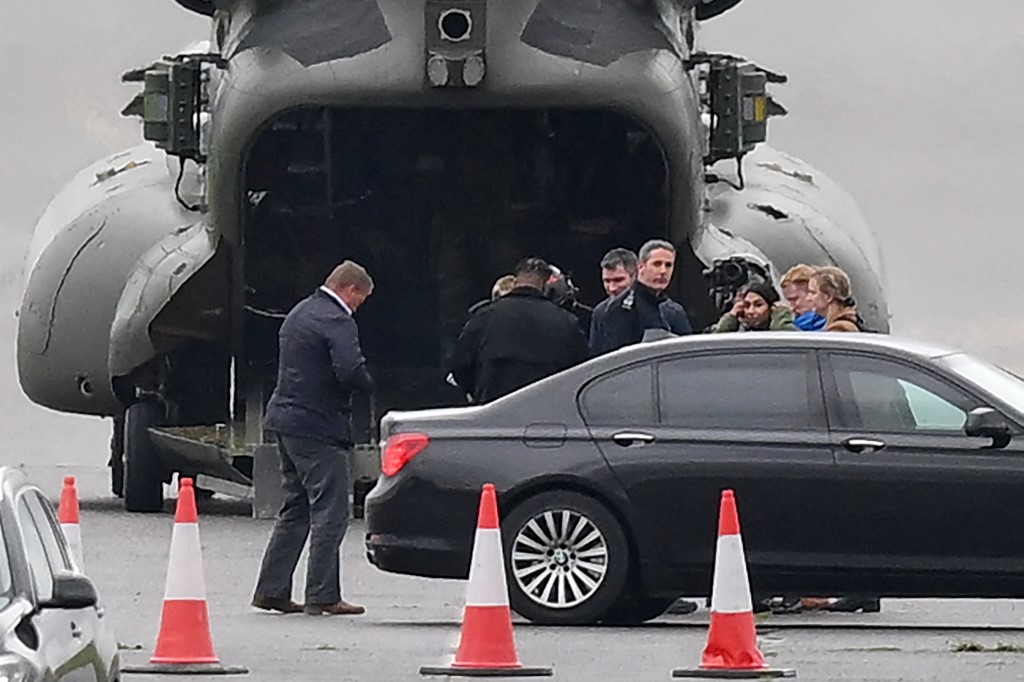 Britain's Home Secretary Suella Braverman (3rd R) disembarks from a Chinook helicopter on her way to visit Manston holding centre for migrants, near Ramsgate, southeast England, 3 November 2022 (AFP)