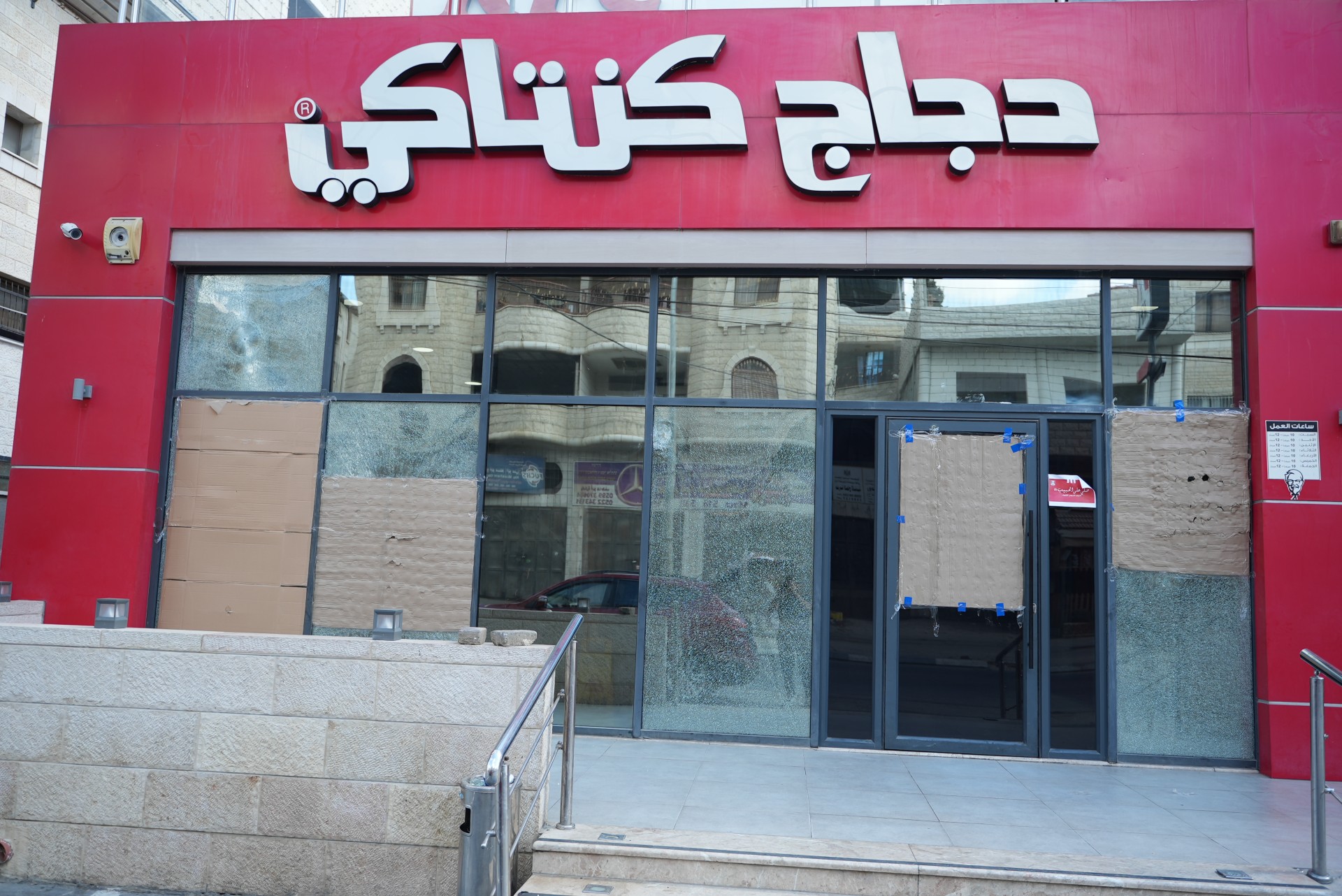 A shop in Huwwara showing damage inflicted by Israeli settlers (MEE/Akram al-Waara)