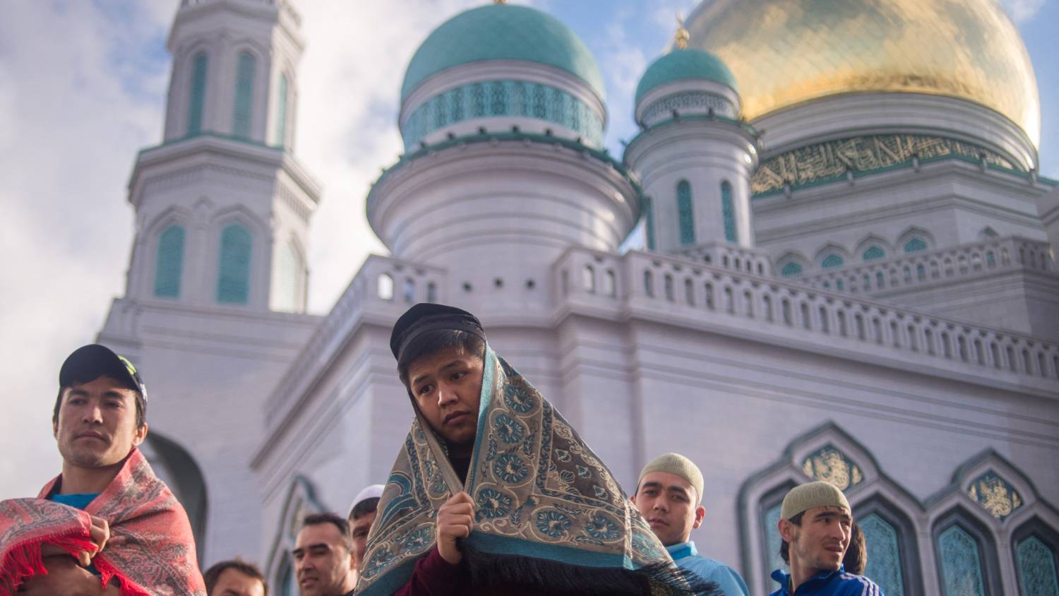 Russians offer communal Eid prayers in Moscow before celebrating the day with friends and family [Aleander Utkin/AFP]