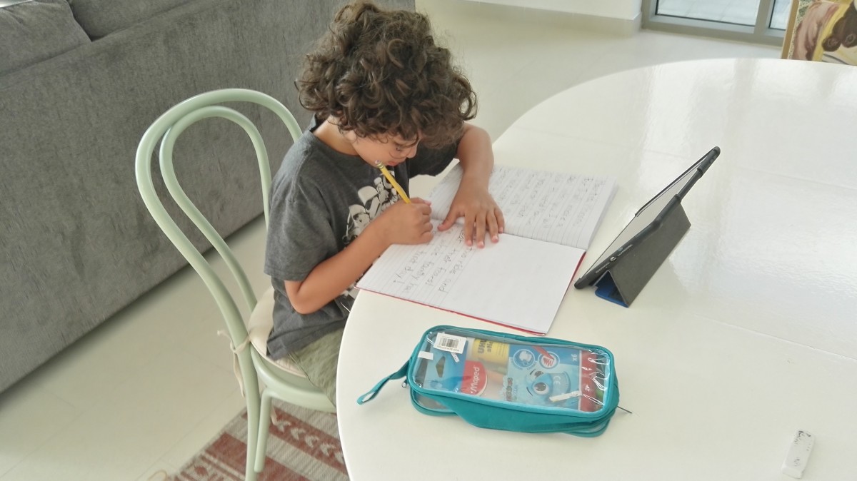 From their home in Dubai, Elimam’s older son attends classes online daily, while the country waits for schools to reopen (Credit: Marwah Elimam)
